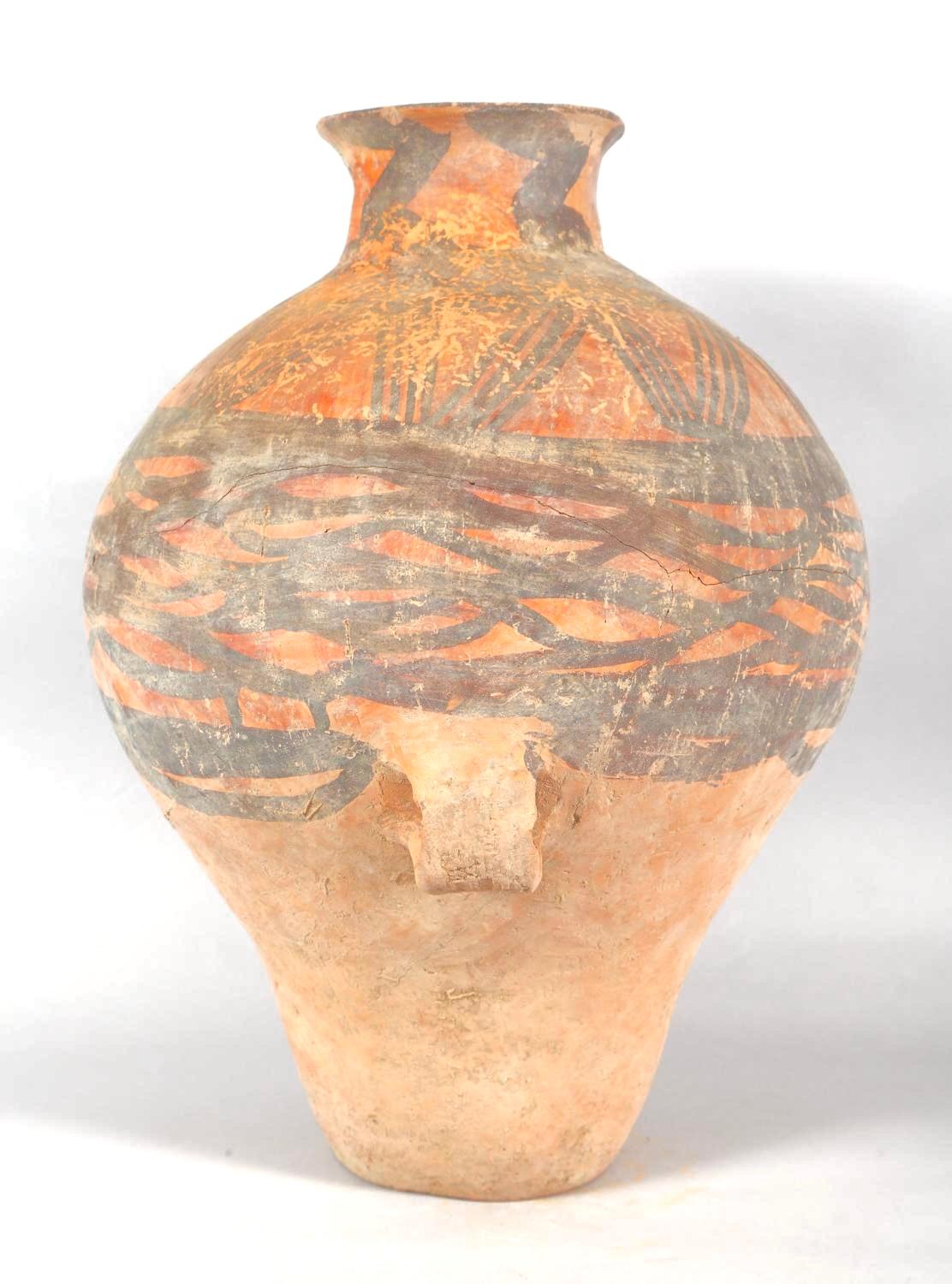 Chinese Neolithic Pottery Jar from the Majiayao Culture, specifically the Machang phase, in northwest China, and dating back roughly 4000 years. Jar is made from earthenware and painted with reddish-brown geometric motif. Jar has a pear-shaped body,