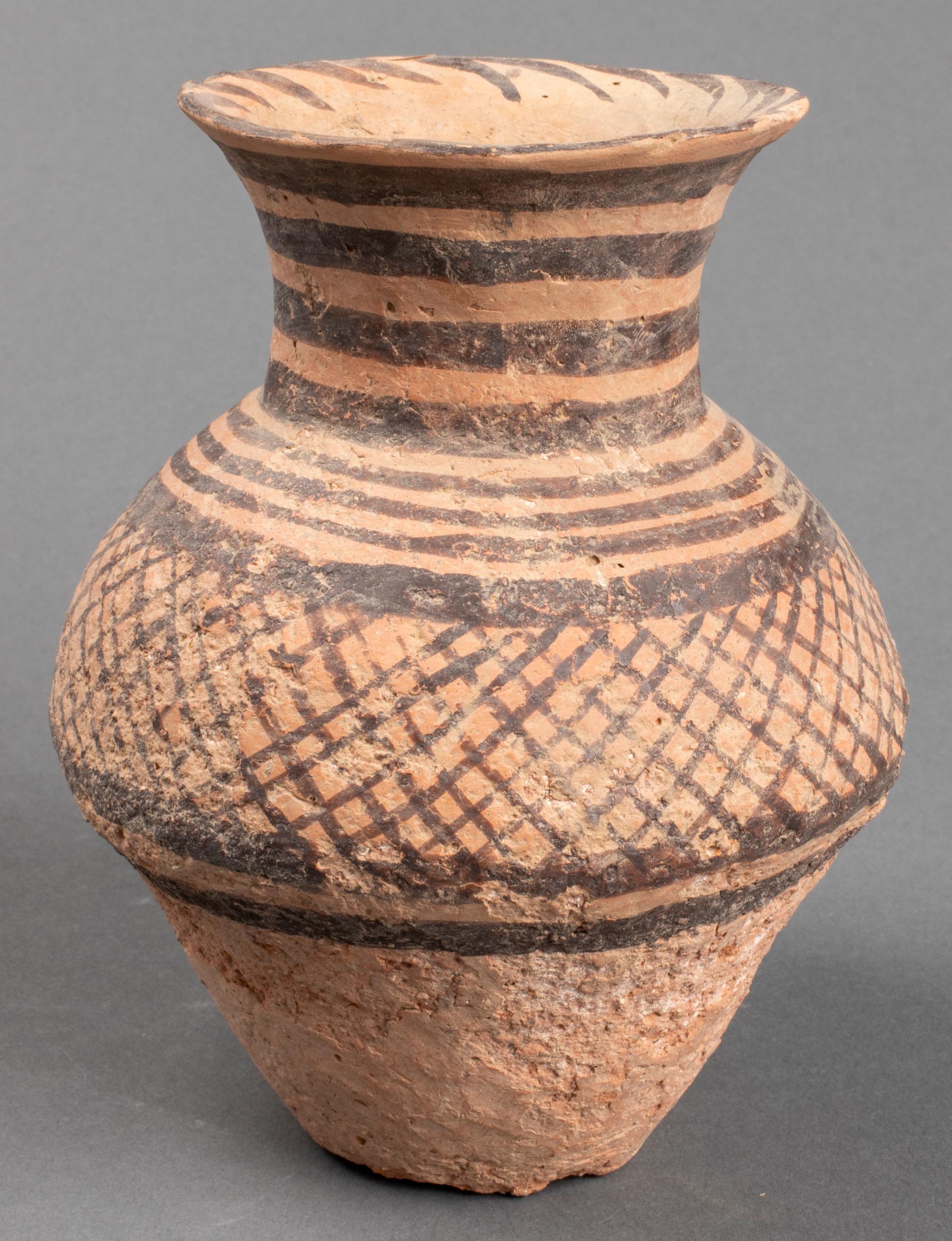 Chinese Neolithic Period (3000 BCE - 2000 BCE) pottery vessel, earthenware with painted decoration. 5.5