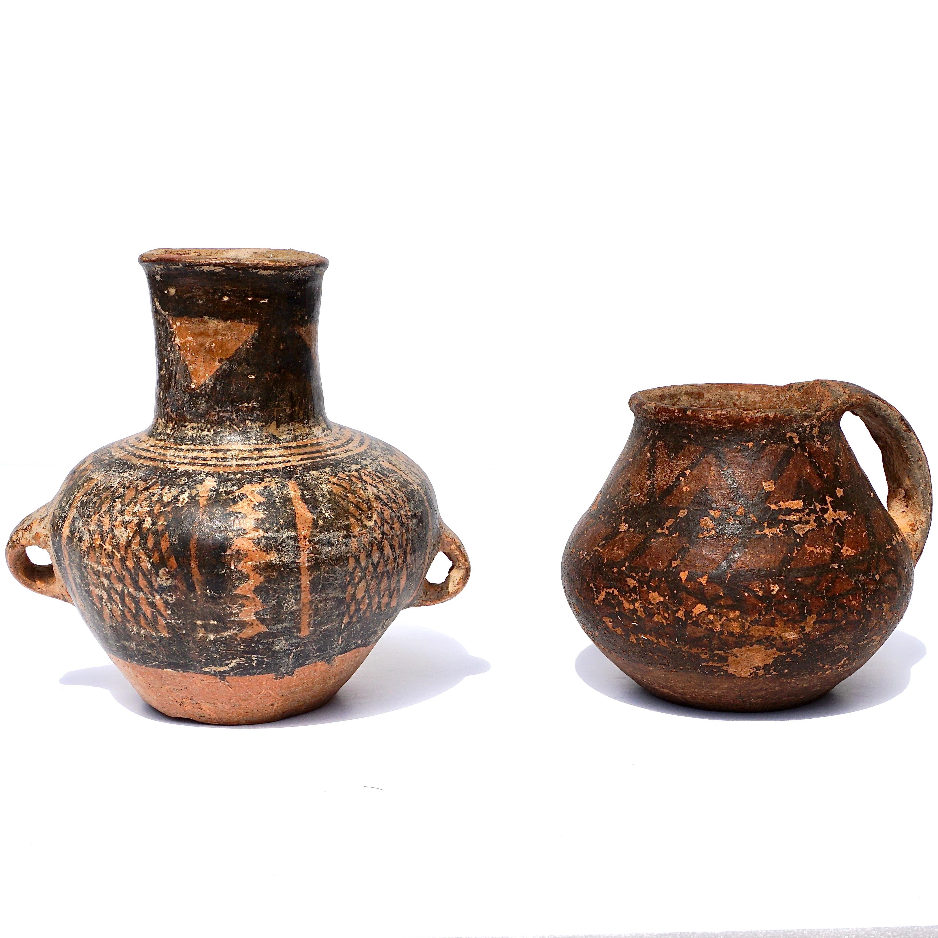 Pair of Neolithic period (5000-3000 BCE) 

Two pieces of Chinese pottery including: 

1.) Jar measuring 6.25