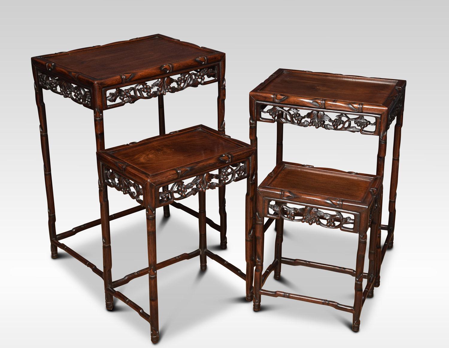 Nest of four Chinese rosewood occasional tables each with a rectangular top with carved faux-bamboo edge. Above a pierced grapevine frieze on faux-bamboo supports joined by stretchers.
Dimensions:
Height 28 inches
Width 19.5 inches
Depth 14