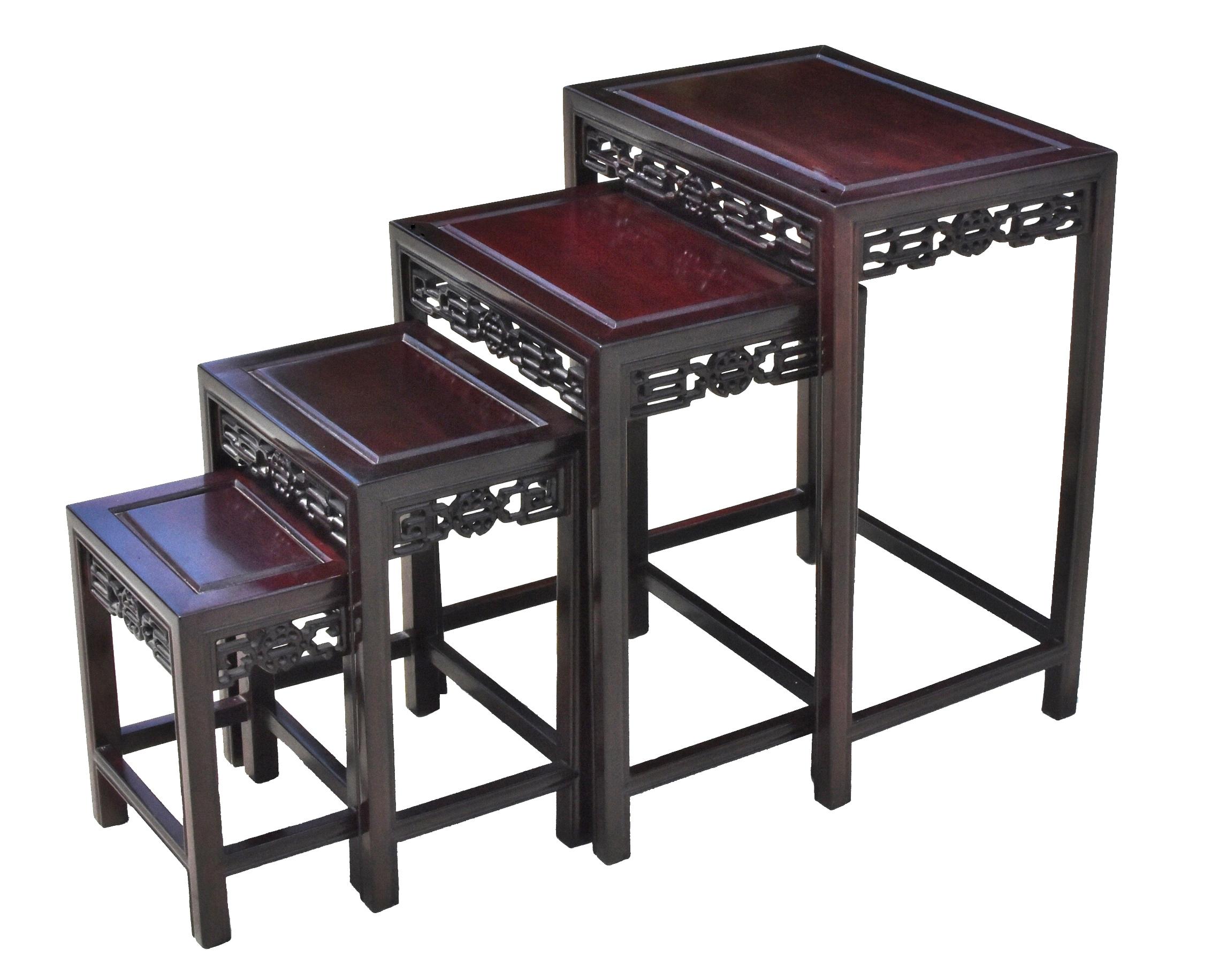 Extraordinary set of four nesting tables in excellent condition. Beautiful fine grade solid rosewood. Carved scrolls of longevity motifs. Prized wood needs no further decoration. Set of 4 tables tuck away and pull out easily. Used individually or