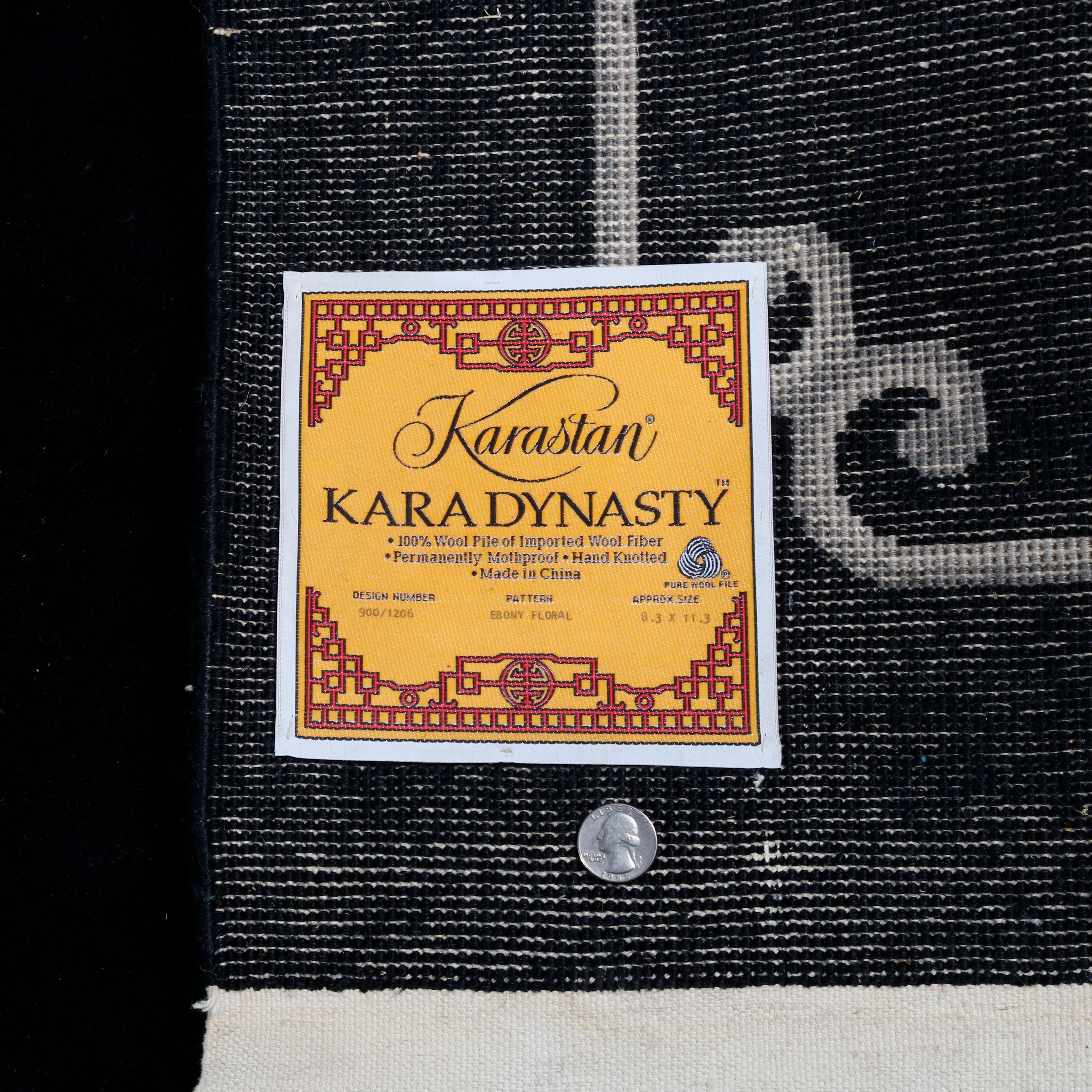 An Art Deco Chinese Nichols style Kara Dynasty rug by Karastan features hand knotted and sculpted floral pattern on black ground 