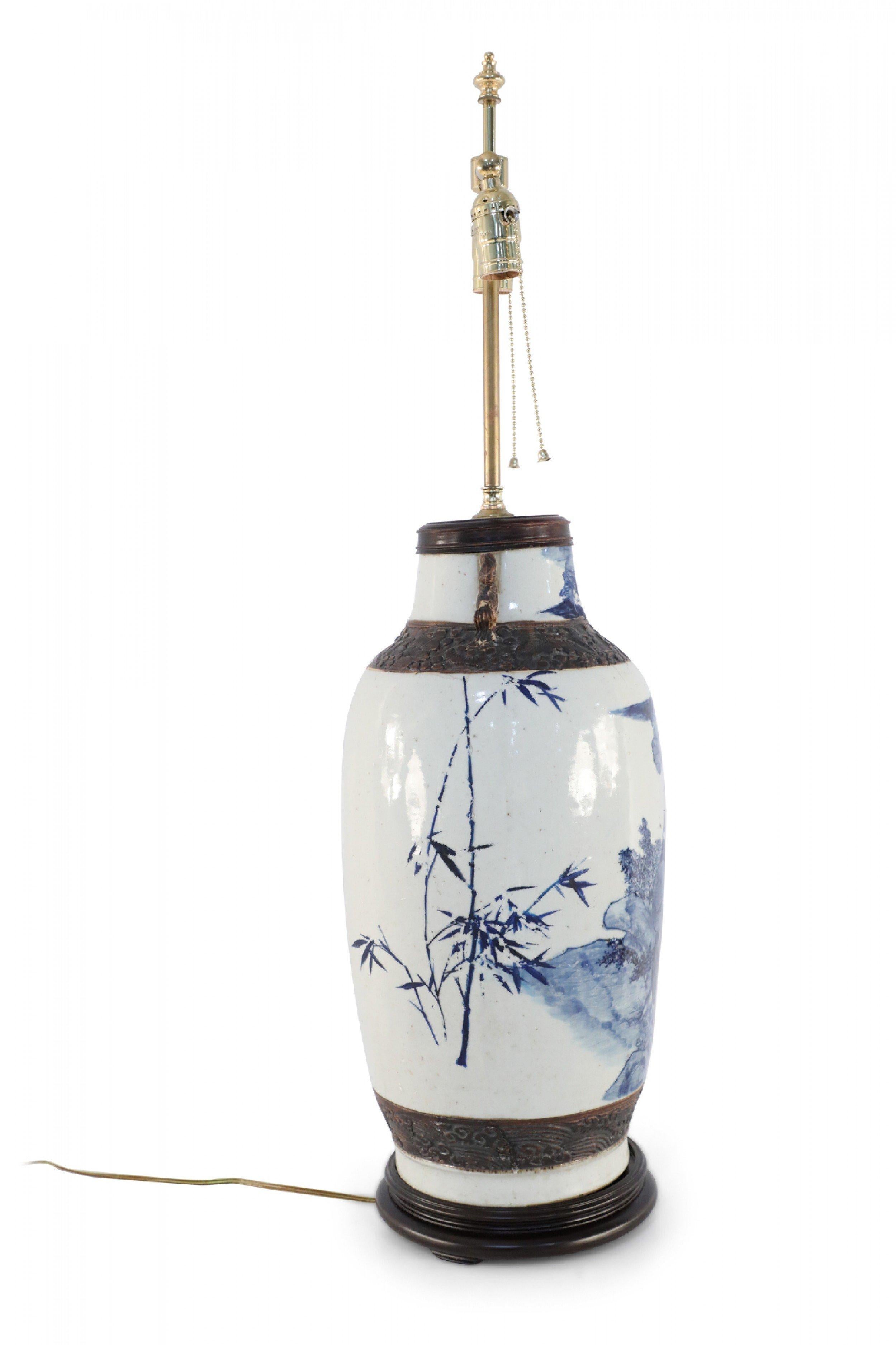 Chinese Export Chinese Off-White and Blue Figurative Scene Stoneware Table Lamp For Sale