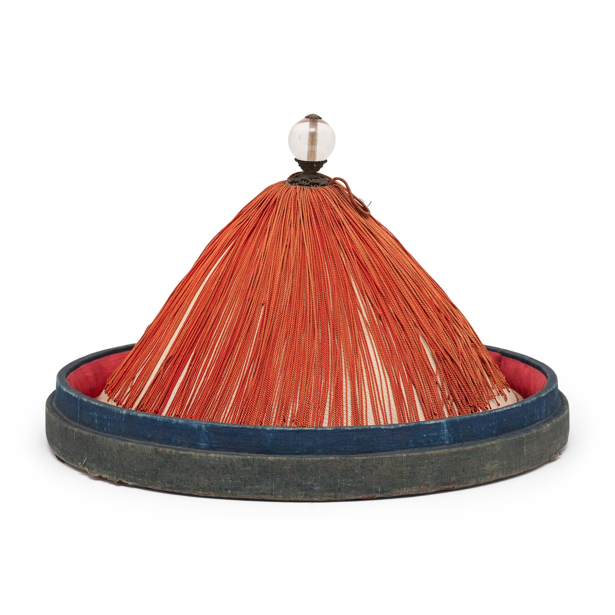 No self-respecting man in Qing-dynasty China would leave the house without some kind of hat. Headgear was central to social status and those of title relied on their hat to convey their rank and cultural identity. This conical hat is the summer hat