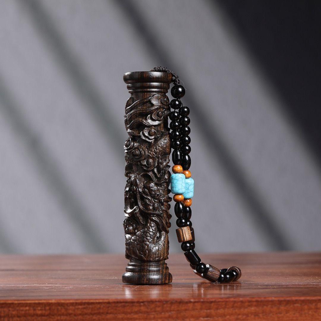 An agarwood carving of a dragon pillar pendant is a captivating piece of art that combines the mystical symbolism of the dragon with the rarity and beauty of agarwood. This type of pendant is not only a testament to exceptional craftsmanship but