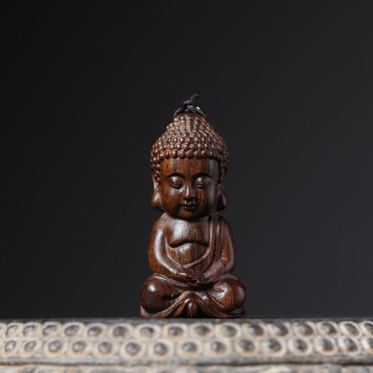 An agarwood carving of a sitting baby Buddha is a beautiful and meaningful artifact that blends spirituality, culture, and master craftsmanship. The depiction of a baby Buddha sitting conveys a sense of peace, purity, and the beginnings of a