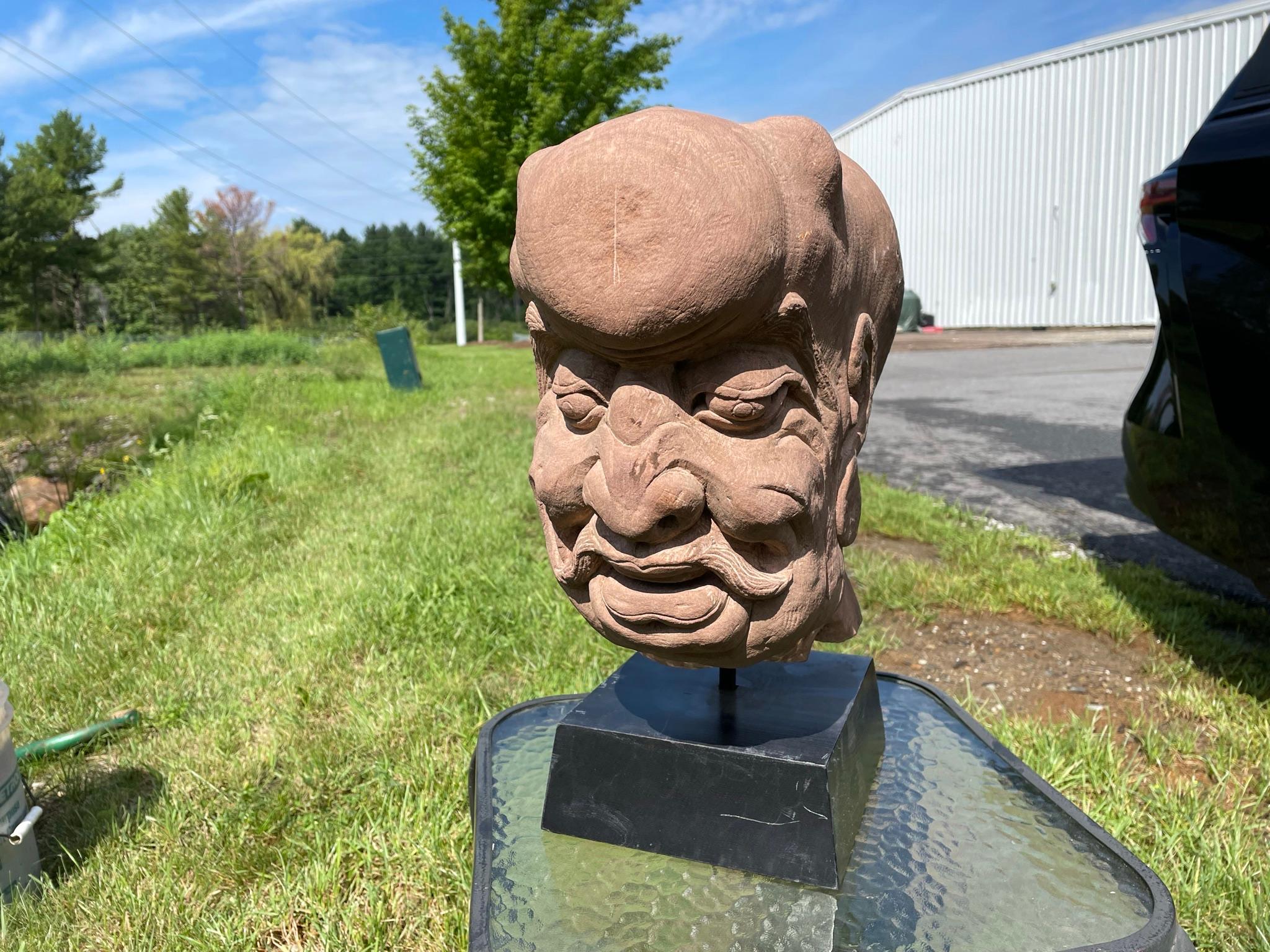 One of a kind.

From western China and collected some 20 years ago, comes this large hand carved red sandstone Lohan or Monk dating to circa 1920. 

This handsome character features fantastic and exaggerated eyes, ears, eye brows and cranial.
