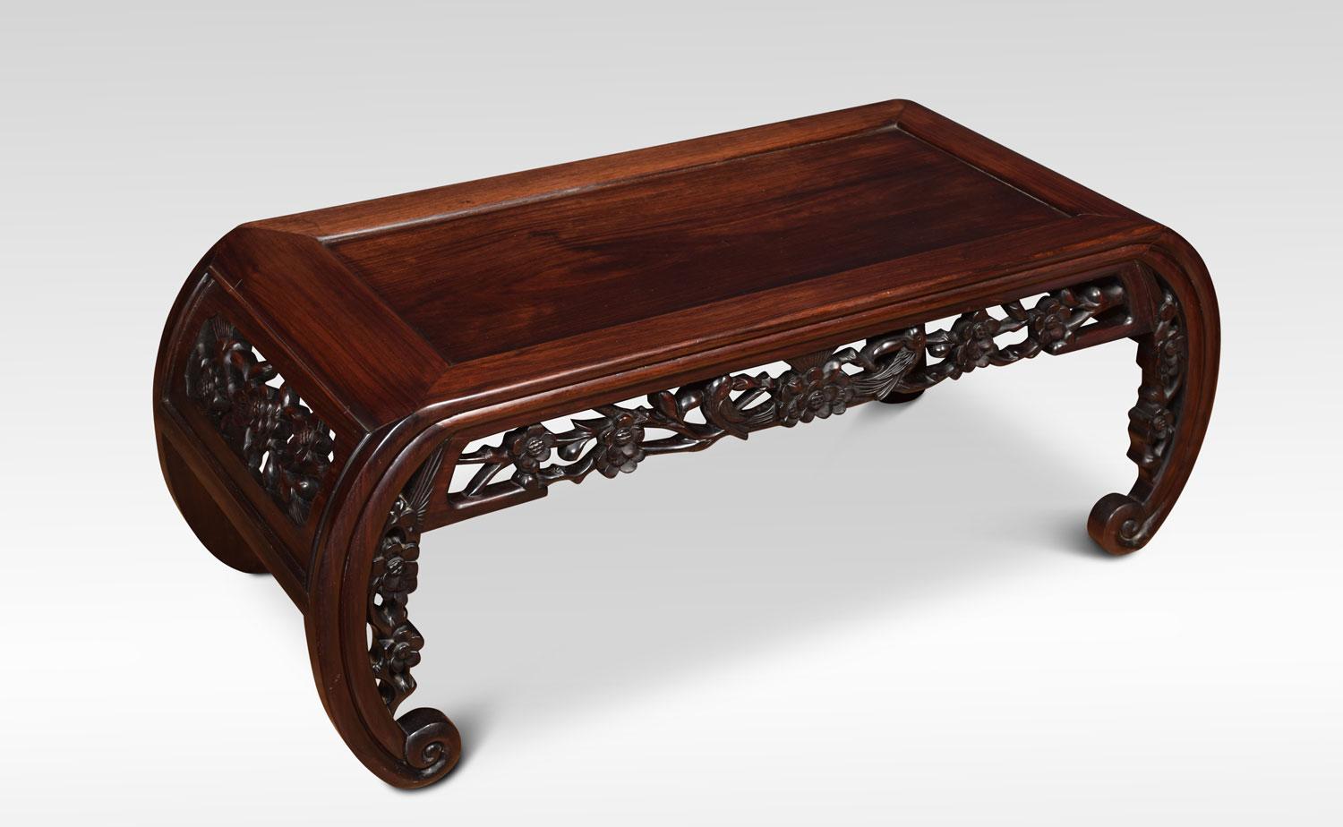 Chinese hardwood opium table, the rectangular panelled top above a pierced and foliate-carved frieze and sides, all raised up on curved scrolling legs.
Dimensions:
Height 13.5 inches
Width 35.5 inches
Depth 15.5 inches.