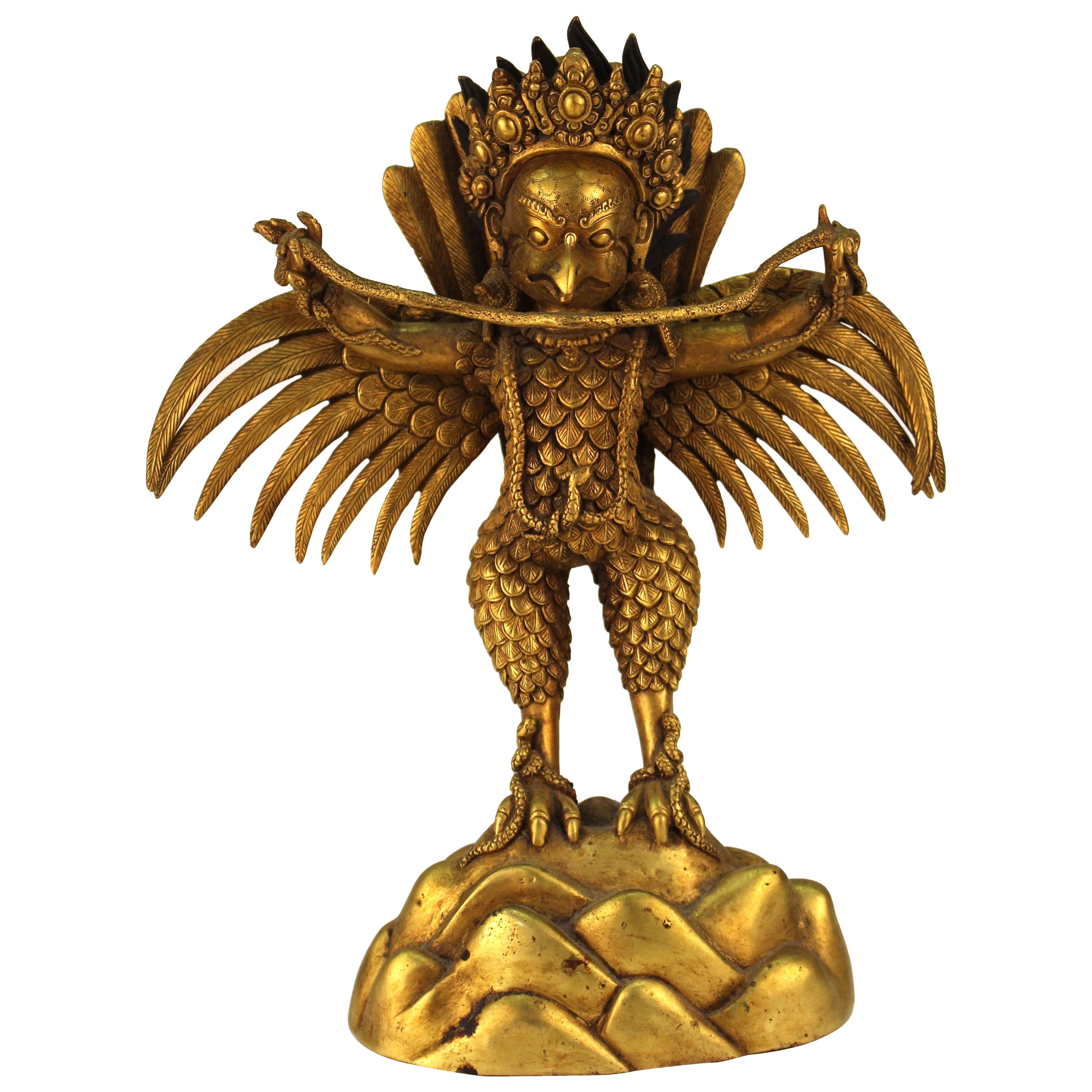 Chinese or Tibetan Gilt Bronze Garuda with Naga Sculpture