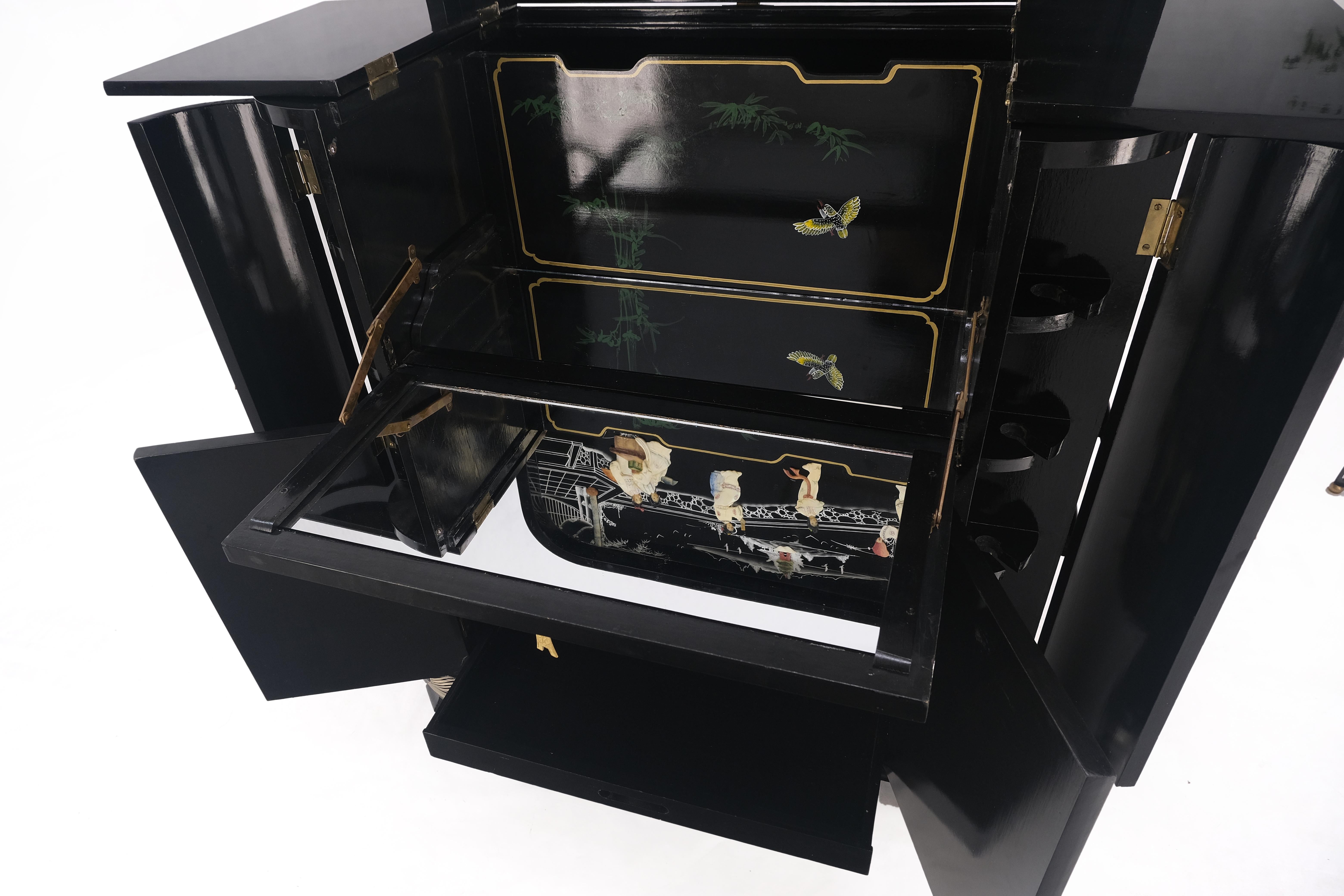 Chinese Oriental Black Lacquer Mother of Pearl Figurine Decorated Liquor Cabinet MINT.
Lots of neat compartments, drop front, lift top liquor cabinet.