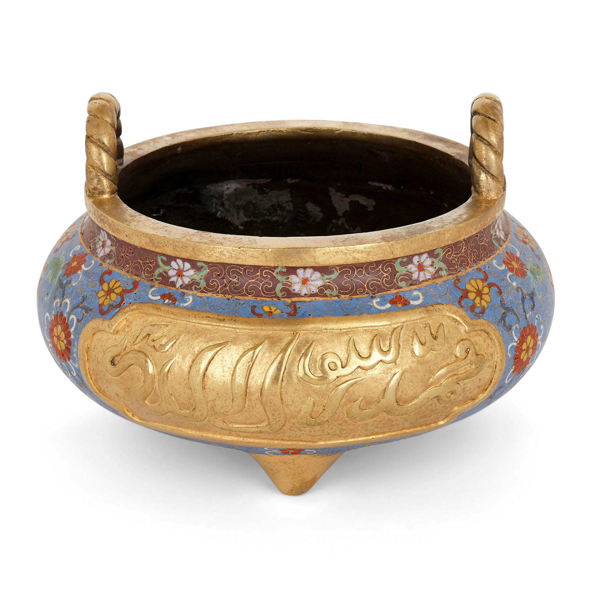Chinese Ormolu and cloisonné enamel vase for the Islamic Market
Chinese, early 20th century
Dimensions: Height 18cm, diameter 25cm

Crafted in China, this fine ormolu and cloisonné enamel bowl was intended for export to Islamic markets. Sitting
