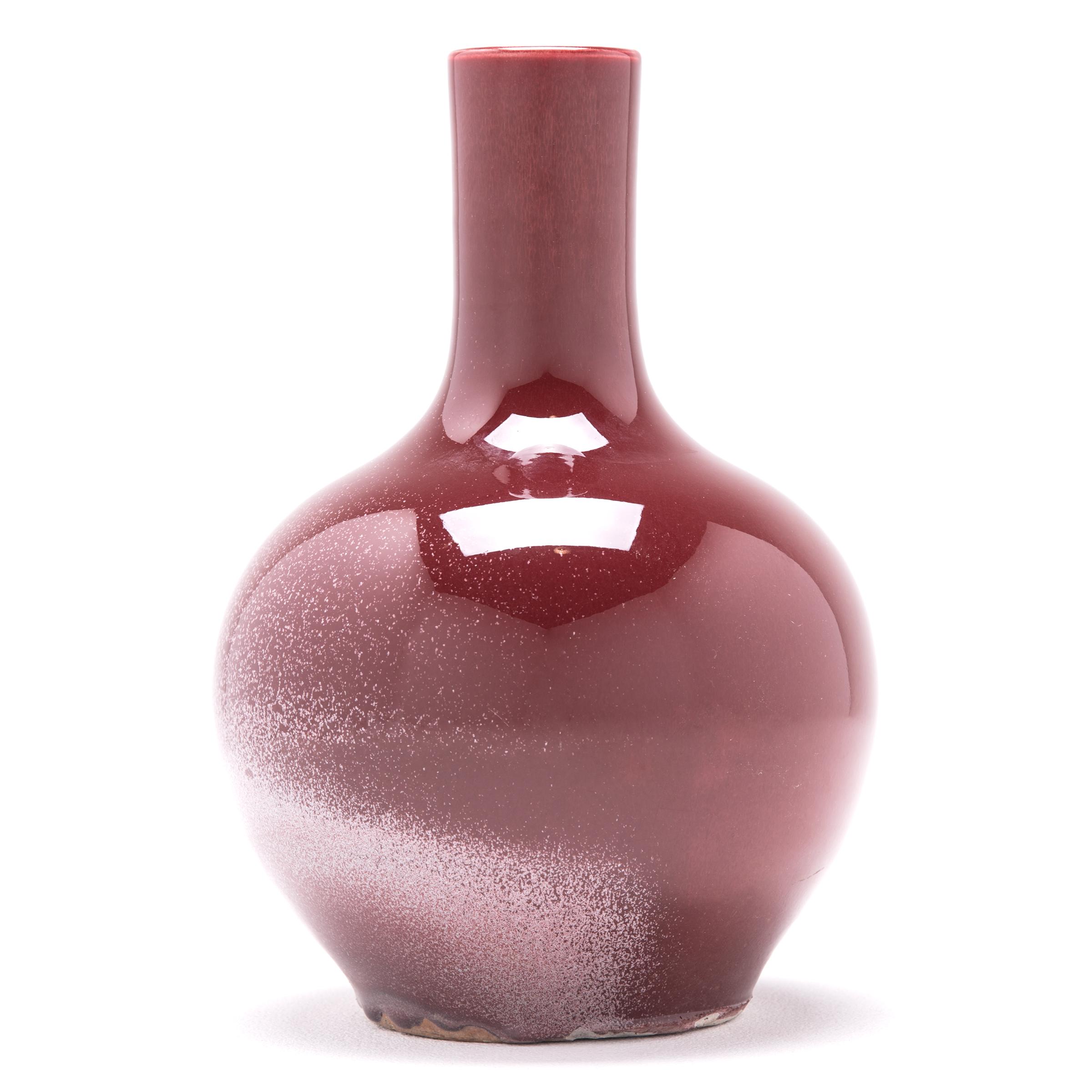 A simple and modern shape defines this gooseneck vase. The vase's deep, rich red glaze is often called 