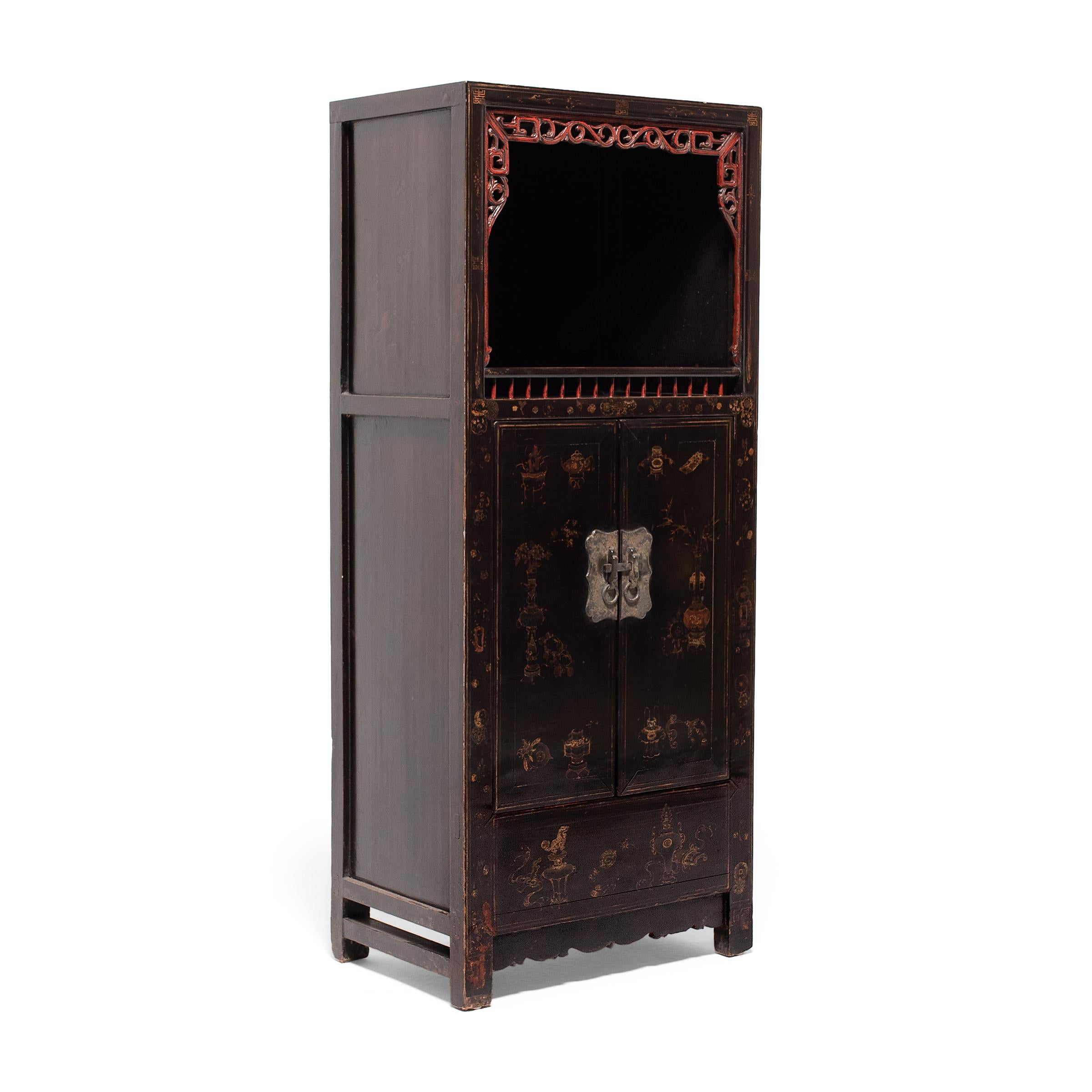 This lacquered display cabinet from Shanxi province was crafted in the mid-19th century using traditional mortise-and-tenon joinery methods. The enclosed lower half was used for general storage and the open upper shelf was used to display precious