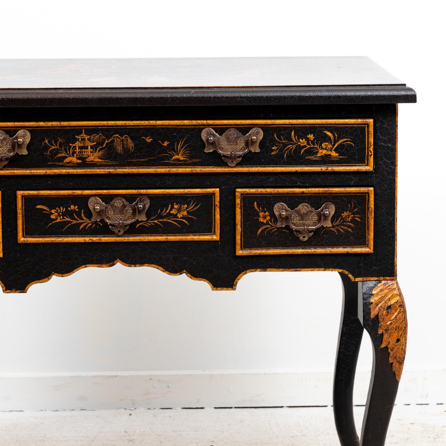 Chinese painted Chinoiserie style side board on cabriole legs with painted pagoda motifs on the drawer fronts and table top. The piece also features one large drawer over three small drawers with metal bat's wing escutcheons. Please note of wear