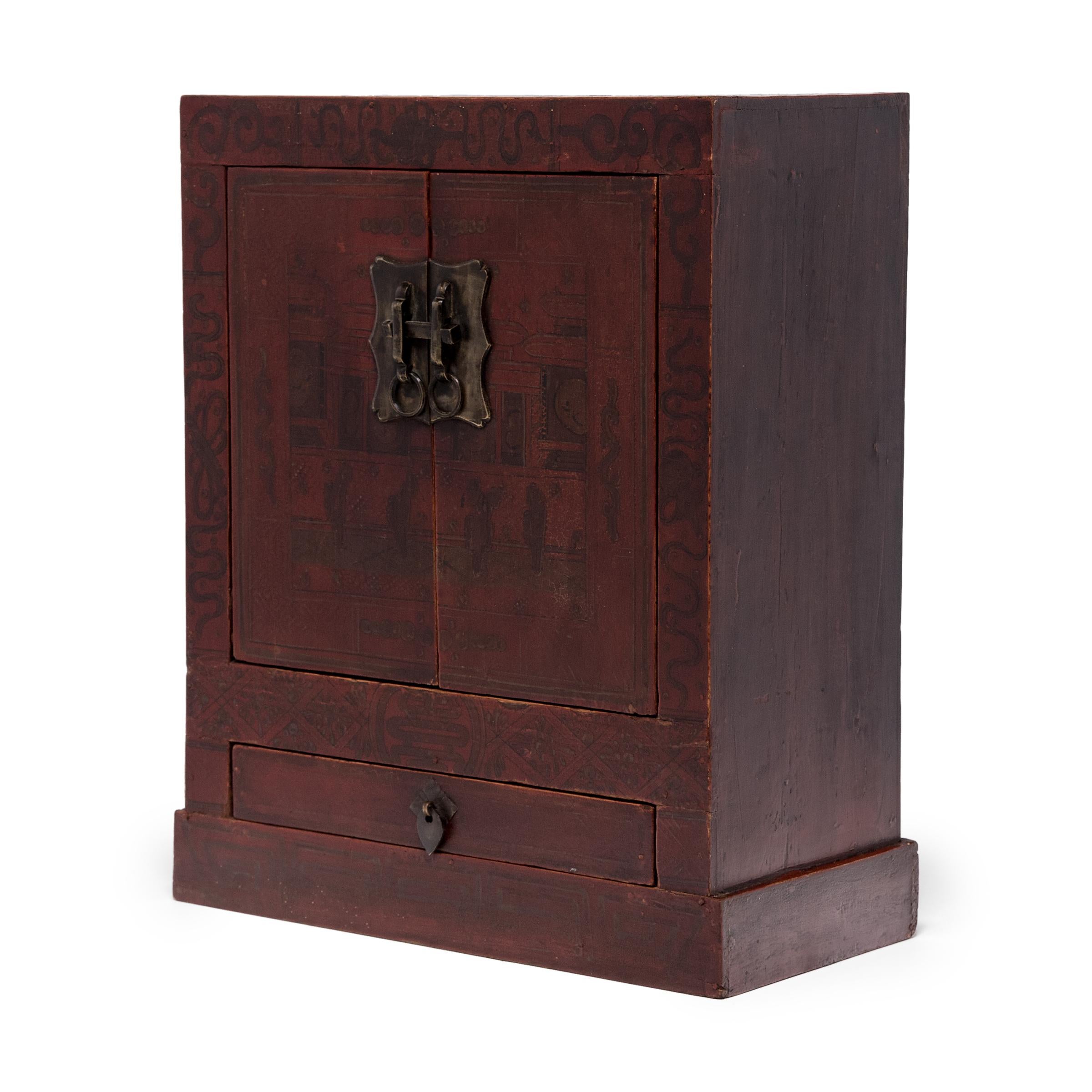 The basic set up for traditional ancestor worship was an altar upon which offerings, ancestral tablets, and images of ancestors were placed. Often the altar was supplemented with a shrine box such as this small red lacquer cabinet, which may have