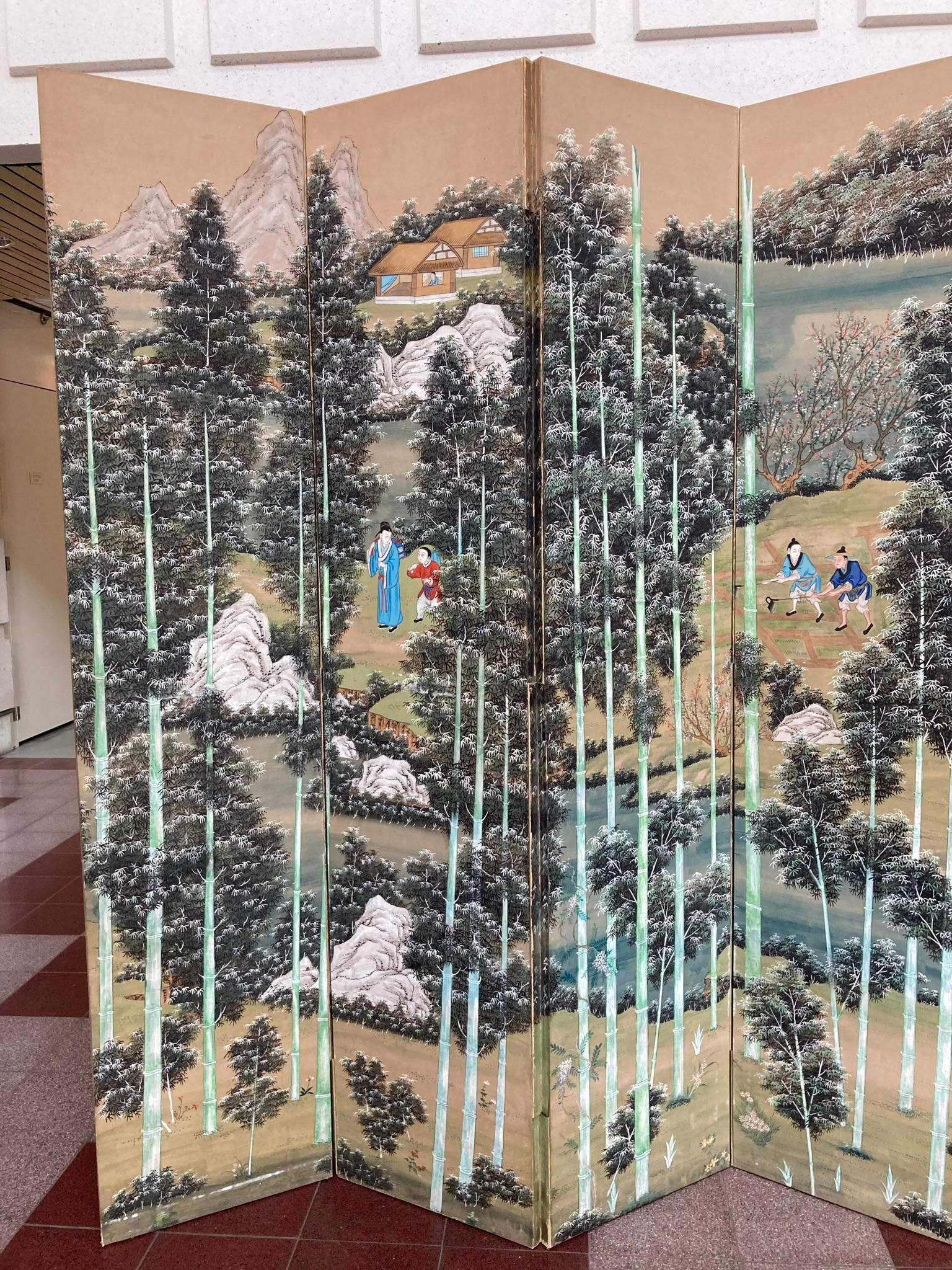 Impressive large-scale Chinese hand-painted six-panel screen depicting a bamboo forest interspersed with groups of figures, houses and rock outcroppings. Hand painted paper, the vertical lines of the bamboo trees give this screen a very modern feel.