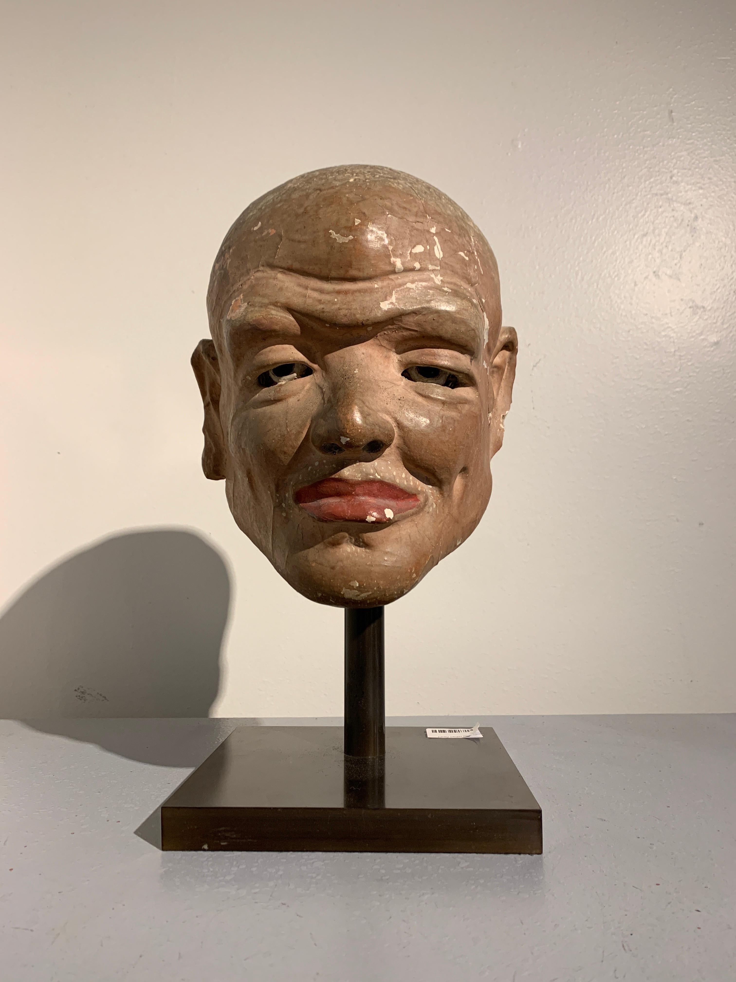 A remarkable Chinese life sized painted stucco head of a luohan, Song, Liao or Jin Dynasty, circa 11th century, China. 

The amazingly life-like figure depicts a luohan (sometime spelled lohan), also known as an arhat, one of the original disciples