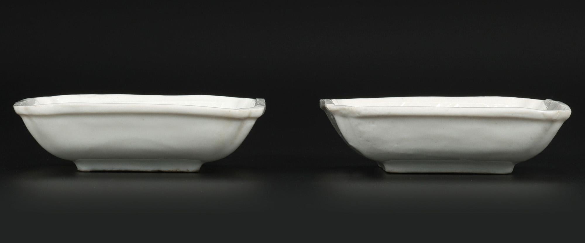 A stunning pair antique Chinese Dehua Blanc de Chine porcelain lotus flower dishes dating from the 17th century and probably made in the early Kangxi reign around 1670. The finely made dishes are of square form standing raised on a narrow square