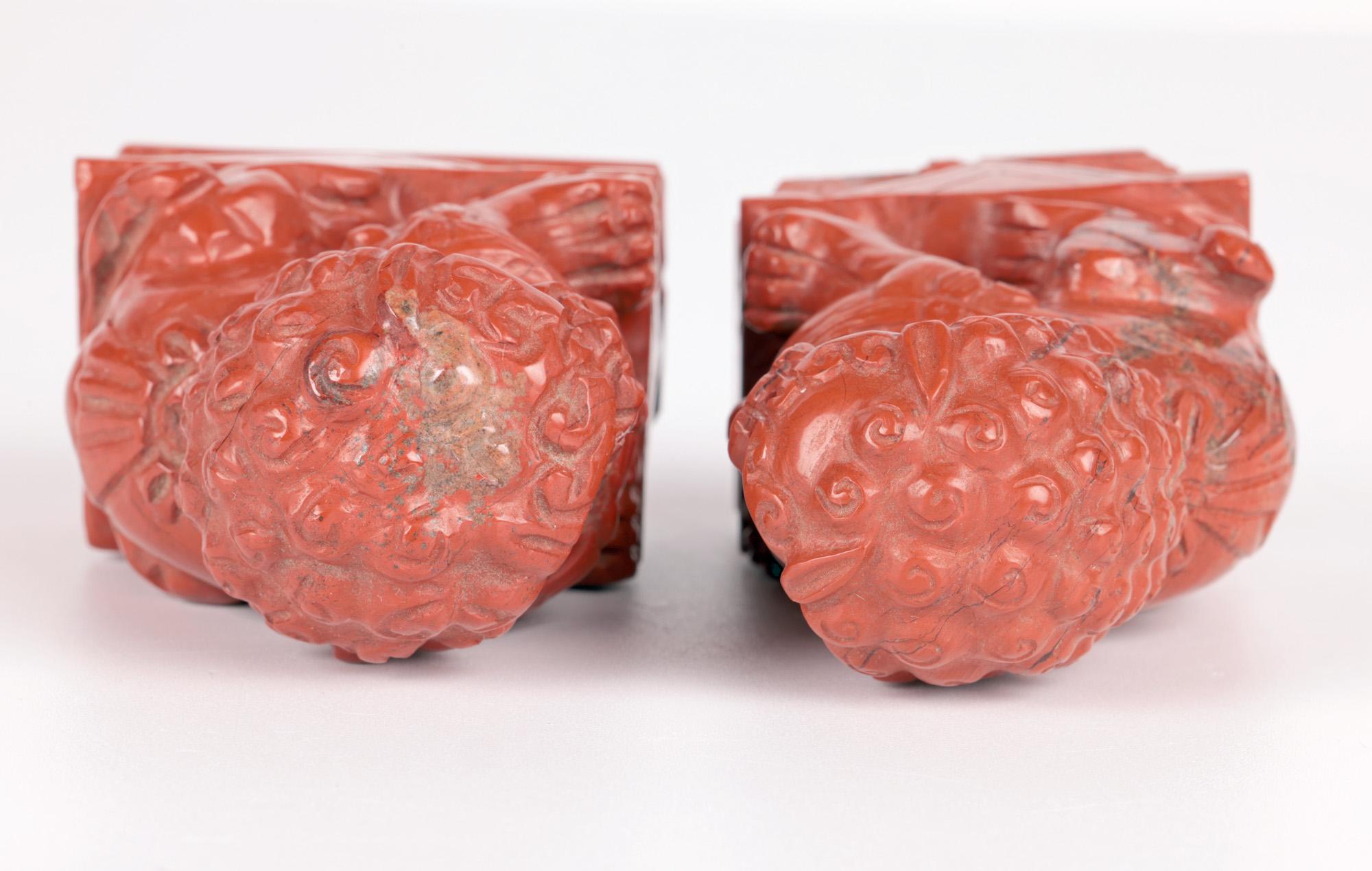 Ceramic Chinese Pair Hand Carved Red Hardstone Mounted Foo Dogs  For Sale