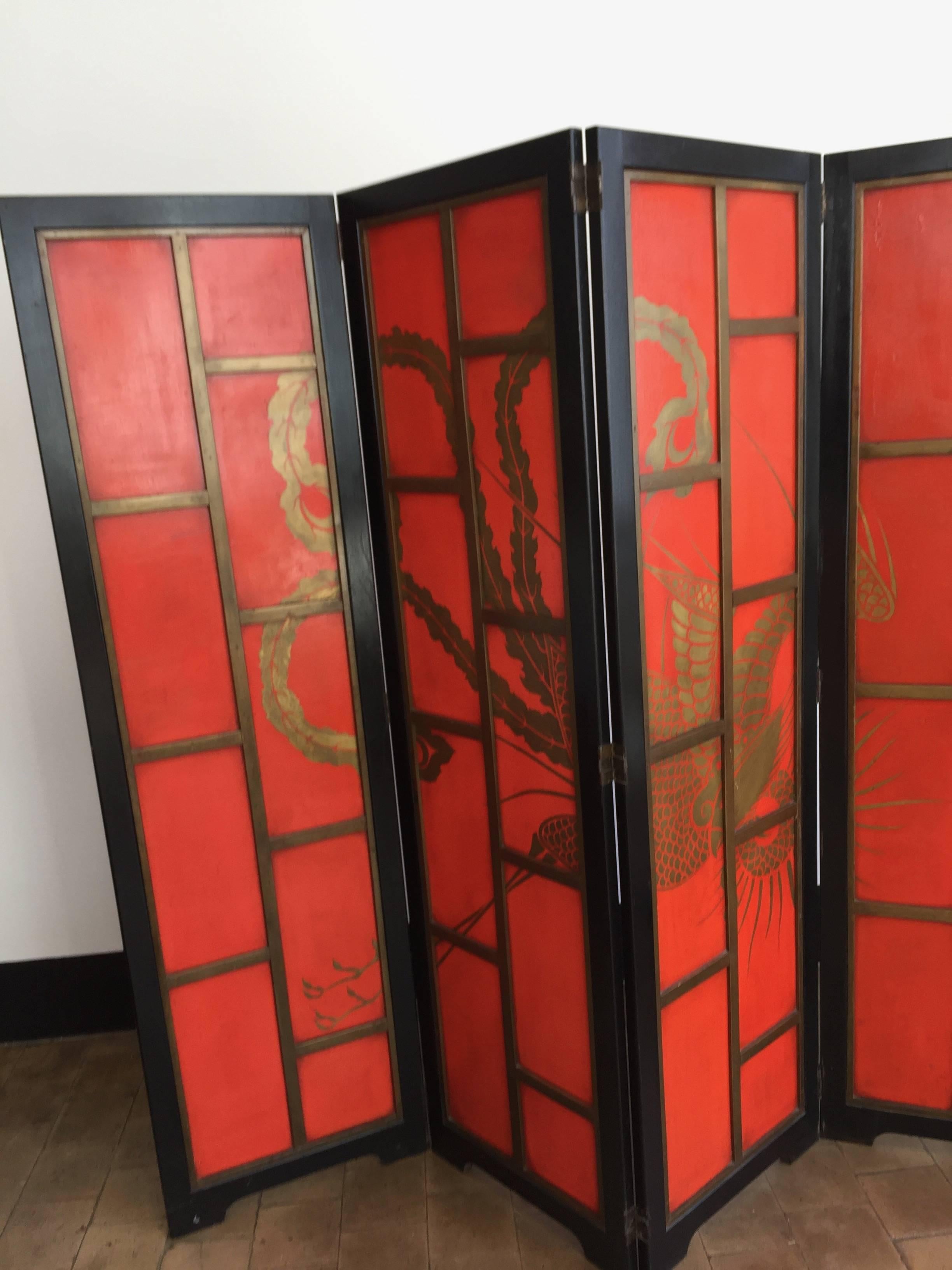 Chinese Paravent, Art Deco style, China red lacker, main frame in black lacquer, base material wood, can be used as room divider as back side as a decoration as well,
Front bird design hand-painted in gold over the four panels, the four panels have