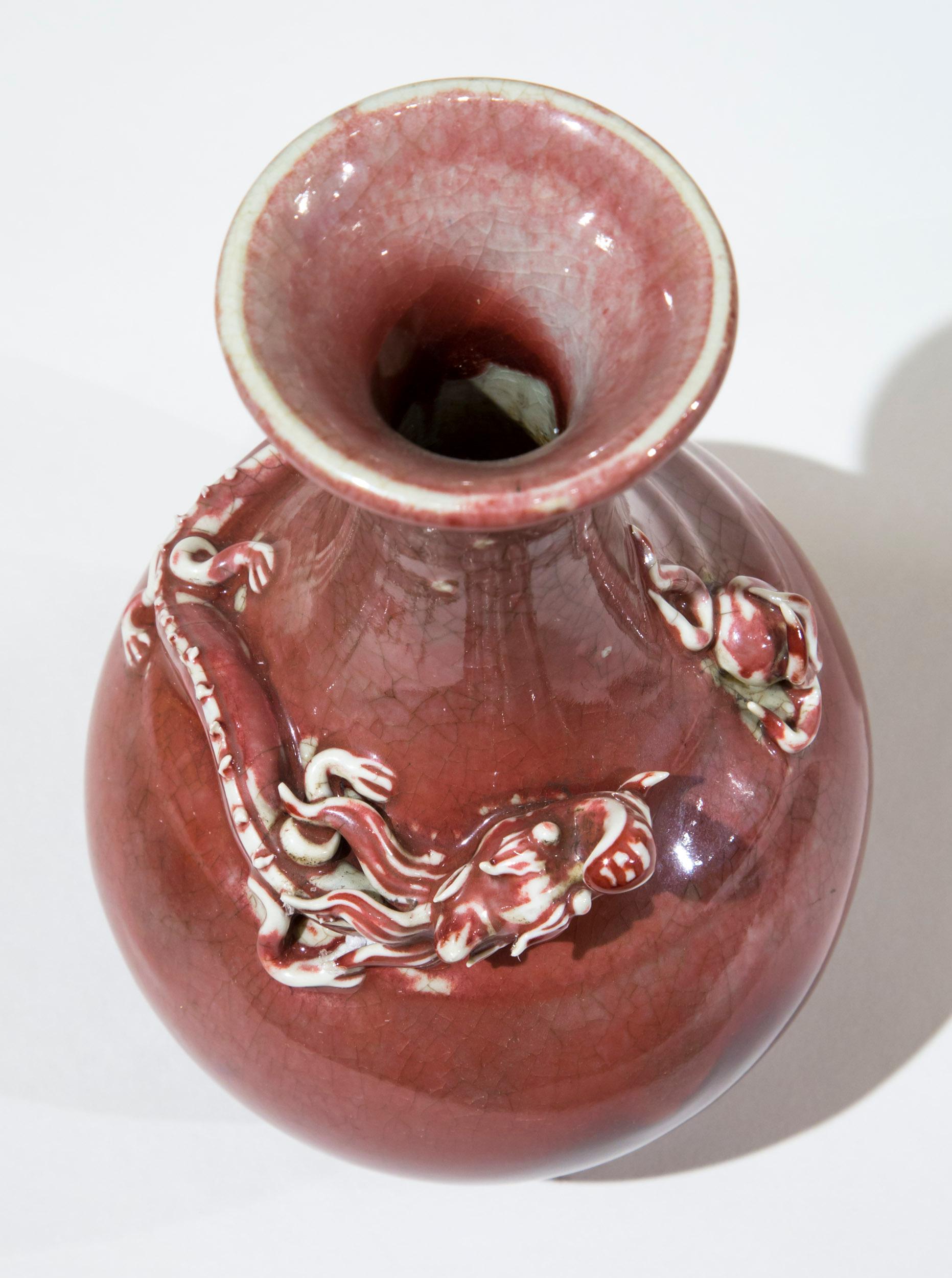 A highly decorative vase, peach bloom crackle glazed, with applied dragon.

China, 20th century.

Measurements
Height 23 cm / 9 in.
  