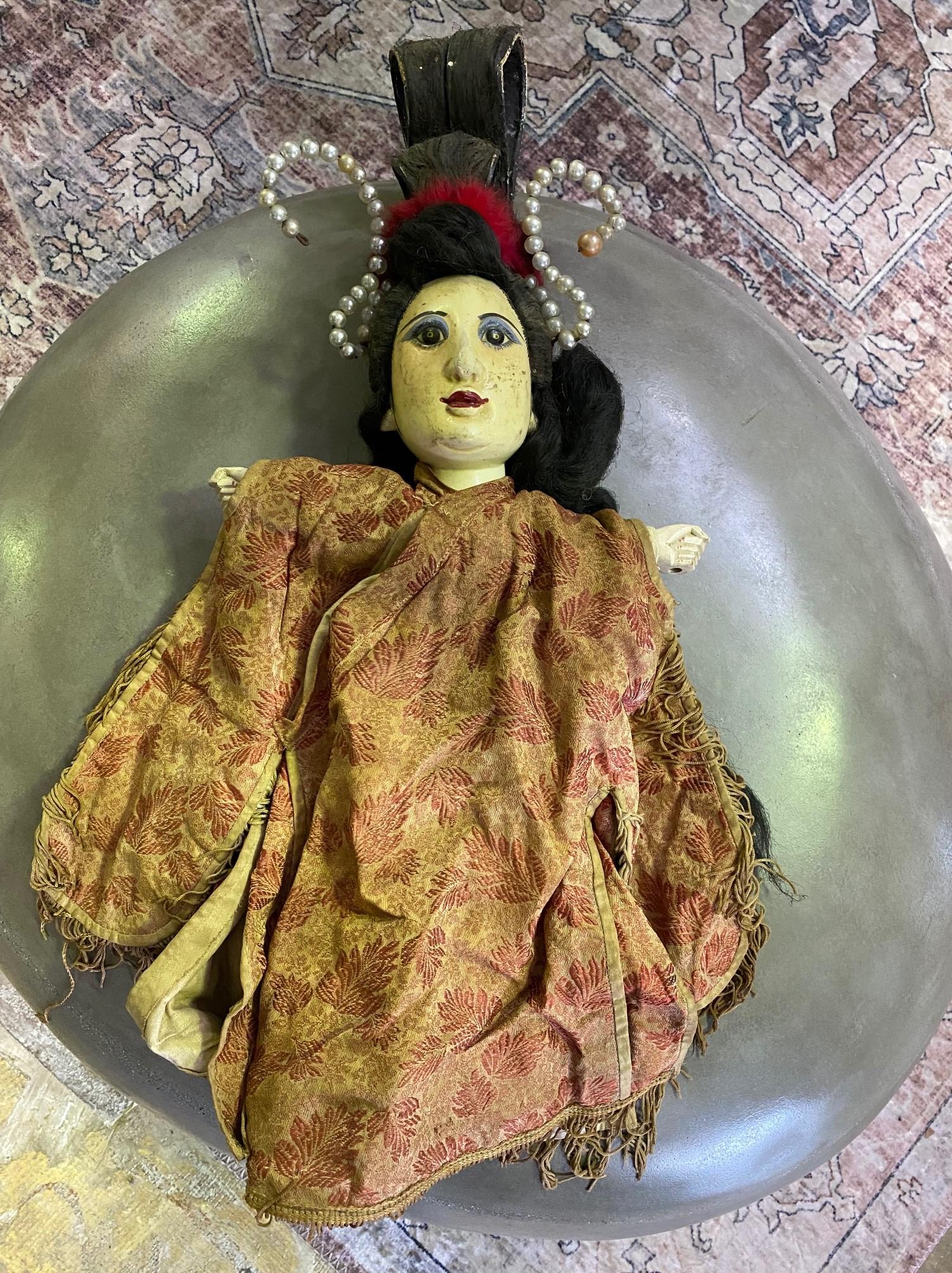 A wonderful work complete with a unique wood-carved and hand painted face, a wonderfully fabulous hairdo, and an original textile garment. 

From a group of 7 Chinese opera puppets, we acquired from a collector. Each puppet shows clear signs of