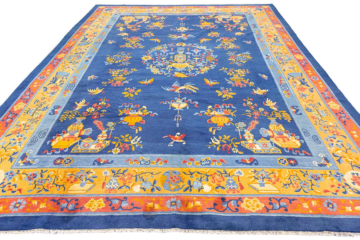 Chinese Peking Rug Blue – 355 × 276 cm
This magnificent Chinese Peking rug showcases a classic blend of imperial elegance and symbolism. Measuring 355 × 276 cm , the rug features a rich indigo blue field filled with finely rendered auspicious