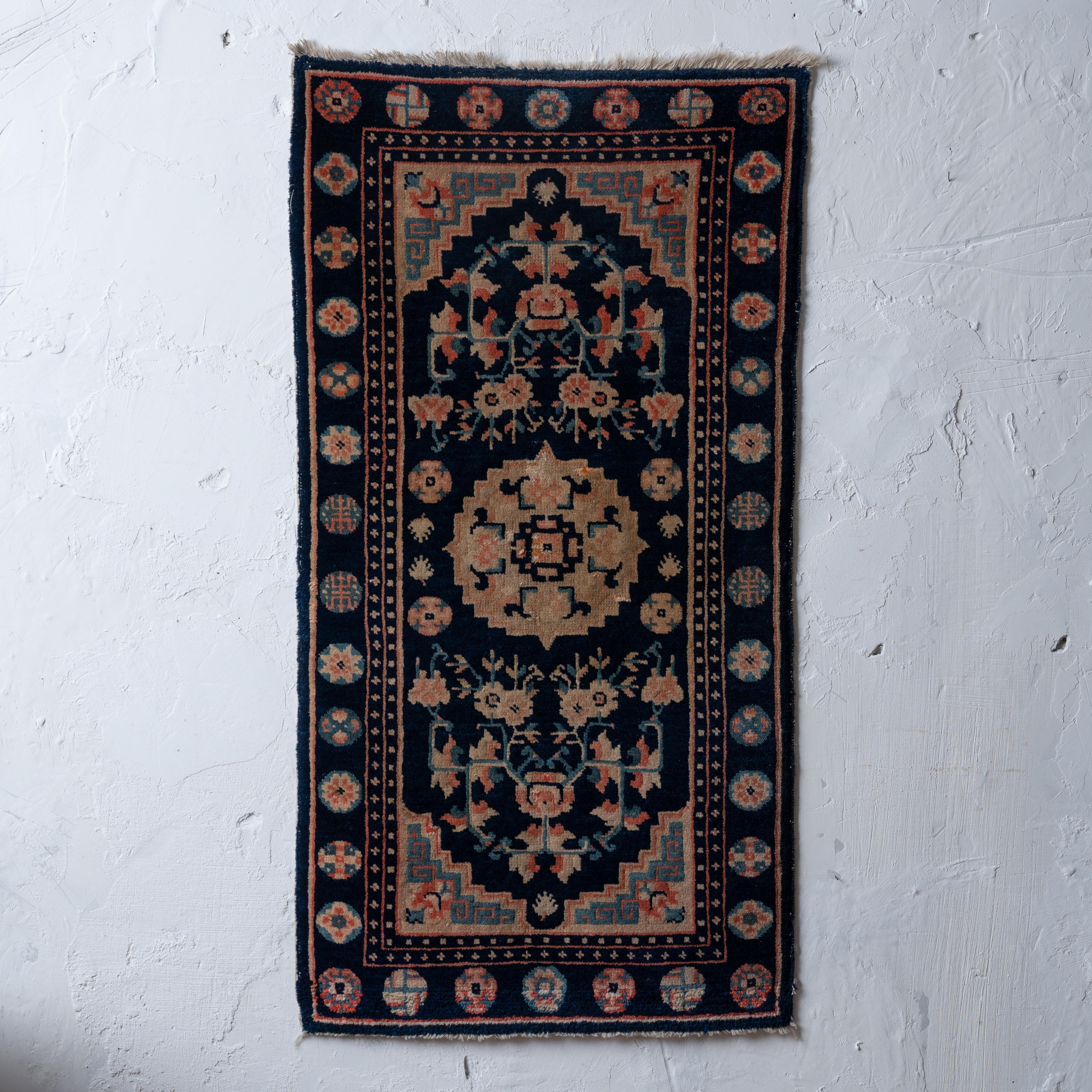 A small Chinese Peking rug, circa 1890s.

22 by 42 inches
