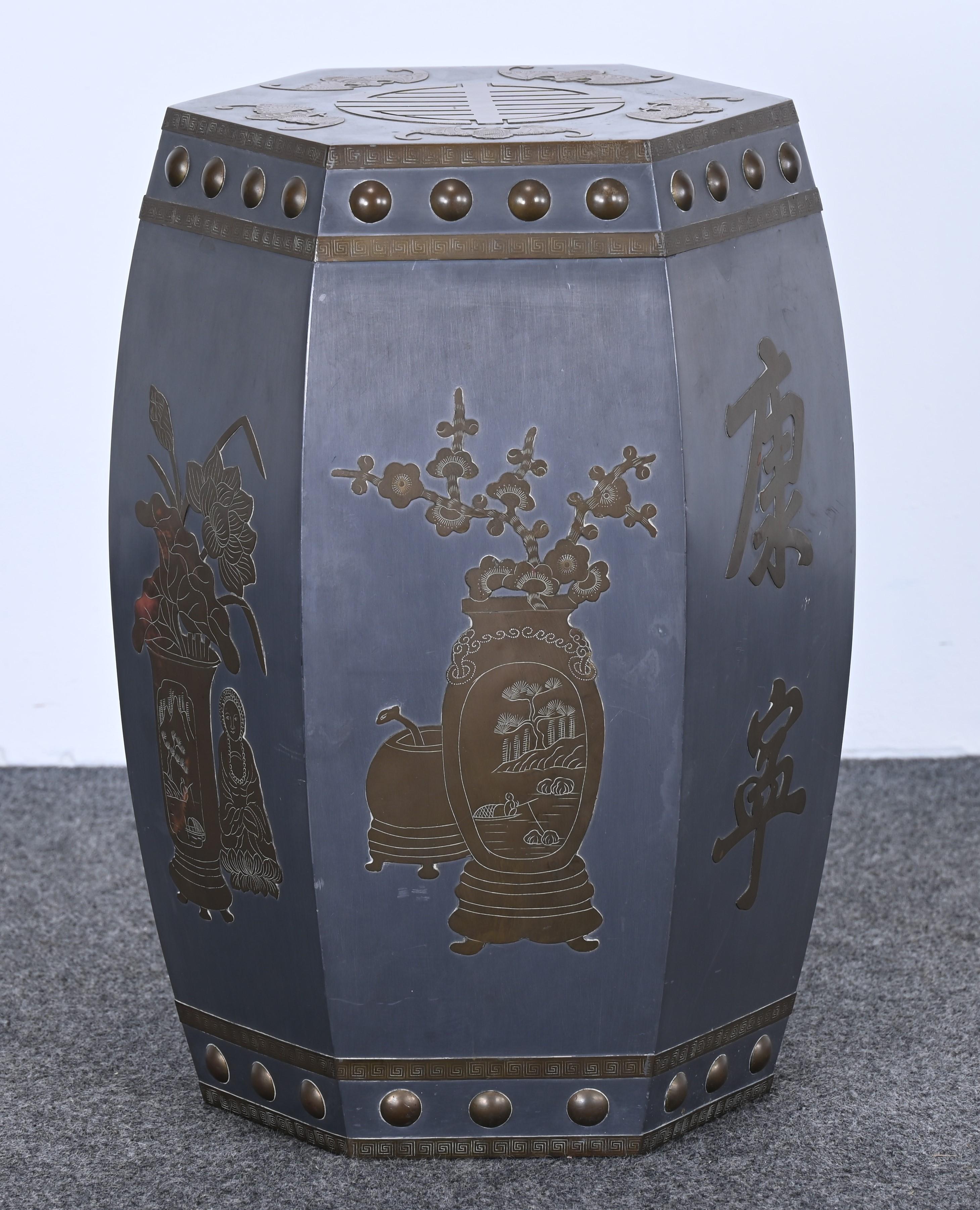 A decorative Chinese pewter and brass garden stool or bench, 1940s to 1950s era. Decorated with beautiful characters such as flowers, vases, bats, and symbols. Marked 