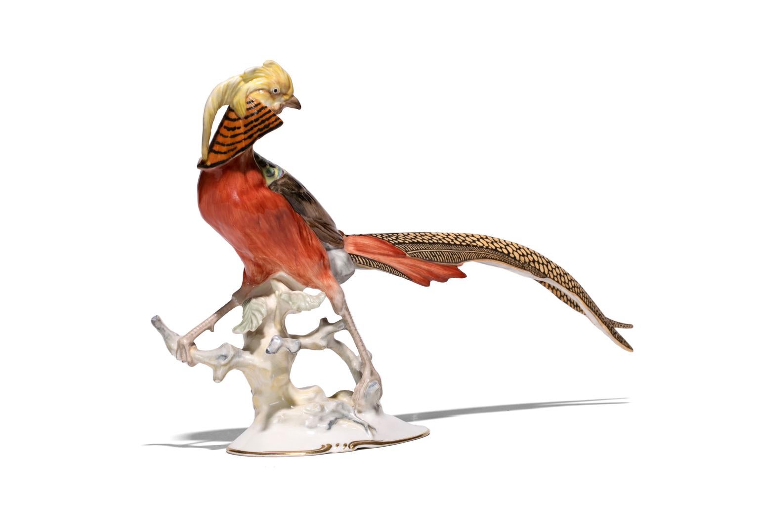 Chinese Pheasant beautifully render with rich oranges, reds, and yellows is a creation of the Hutschenreuther-Selb porcelain manufacturer. The authentic Hutschenreuther-Selb stamp is on the verso. It has a beautifully rendered undulating line from