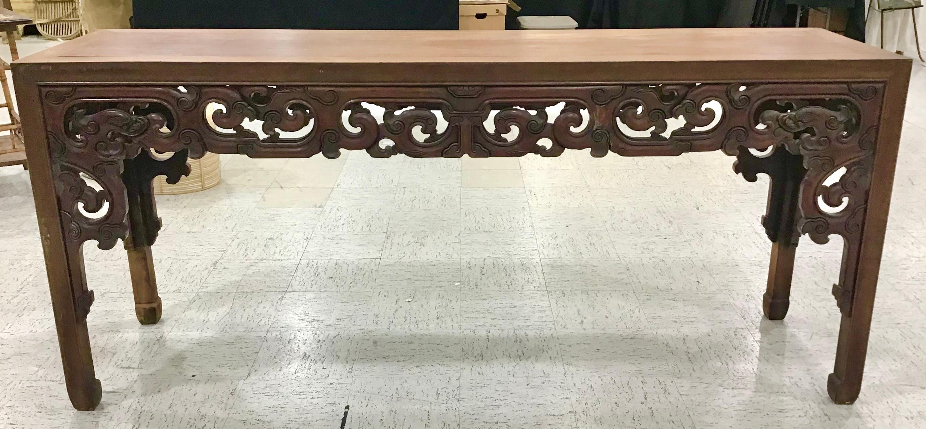 Chinese altar / console table, stunning pierced carved design on each all around. Carved Chinese symbols & Dragons on all four sides symbolic of strength. Its classical proportion gives an air of lightness yet its structured perfectly, strong and
