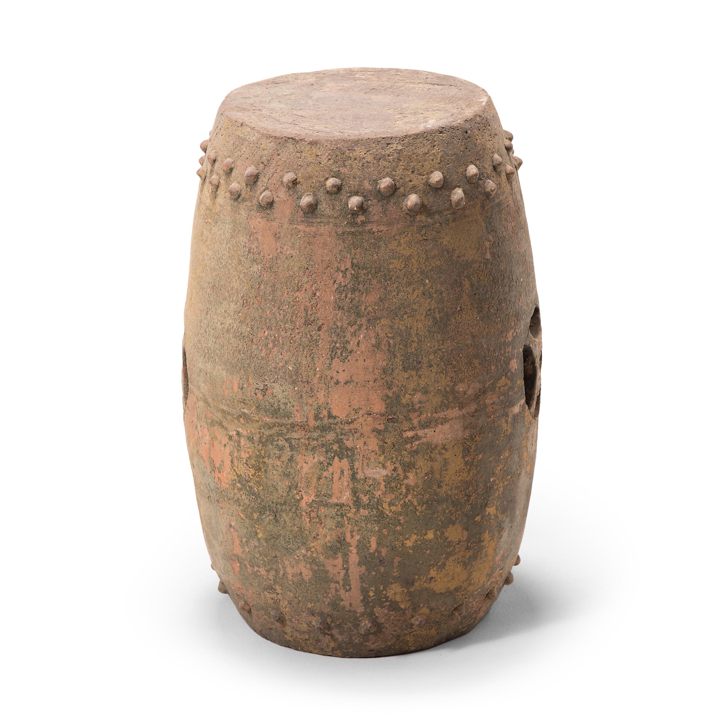 This early 20th century terracotta garden stool was created in Pingyao, an ancient, respected city in China's Shanxi province. With a history dating as far back as c. 800 B.C., Pingyao is widely known for its well-preserved Ming- and Qing-dynasty