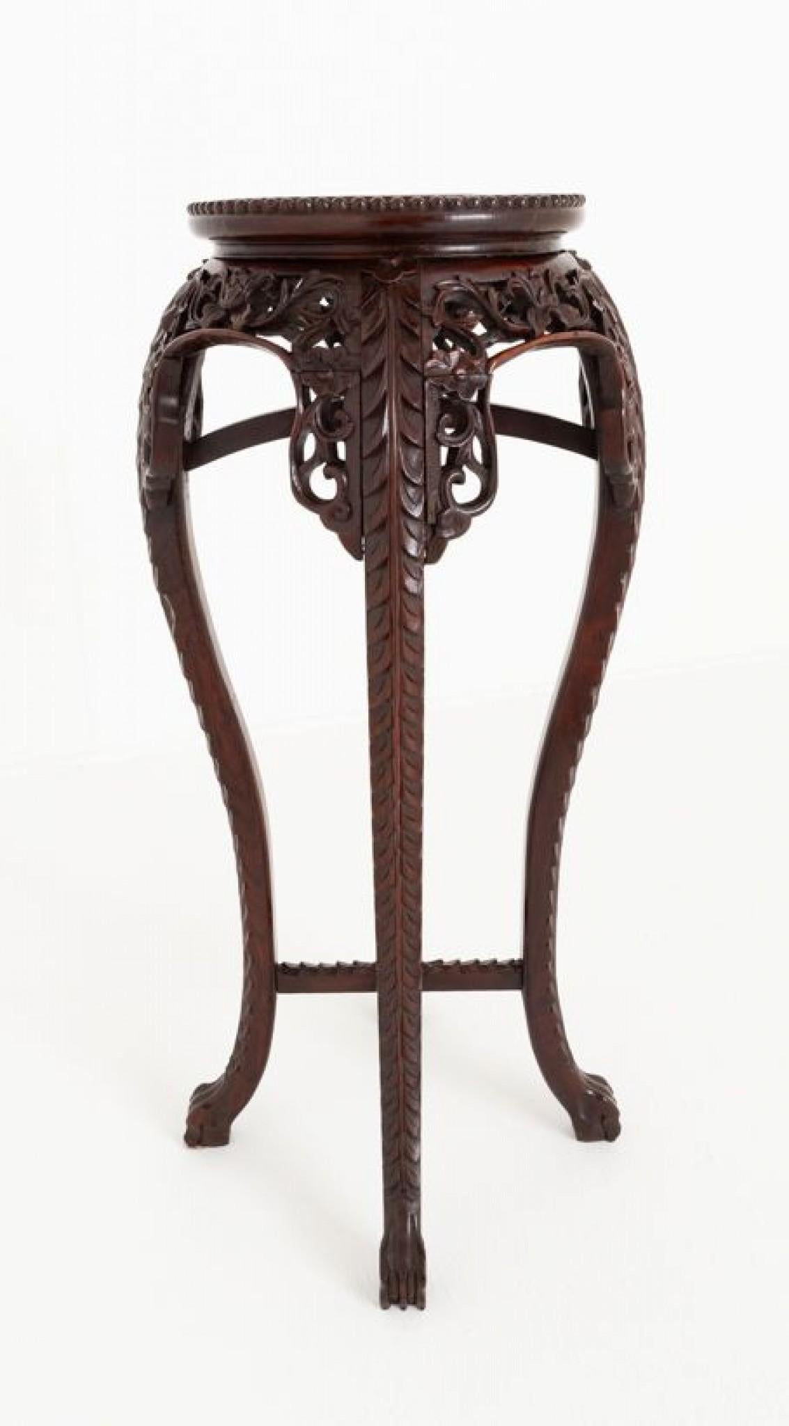 Chinese hardwood plant stand.
Circa 1880
This plant stand being of a typical chinese form.
The shaped legs featuring carved pierced detail to the tops.
Having a marble insert and carved moldings.
Presented in good condition.