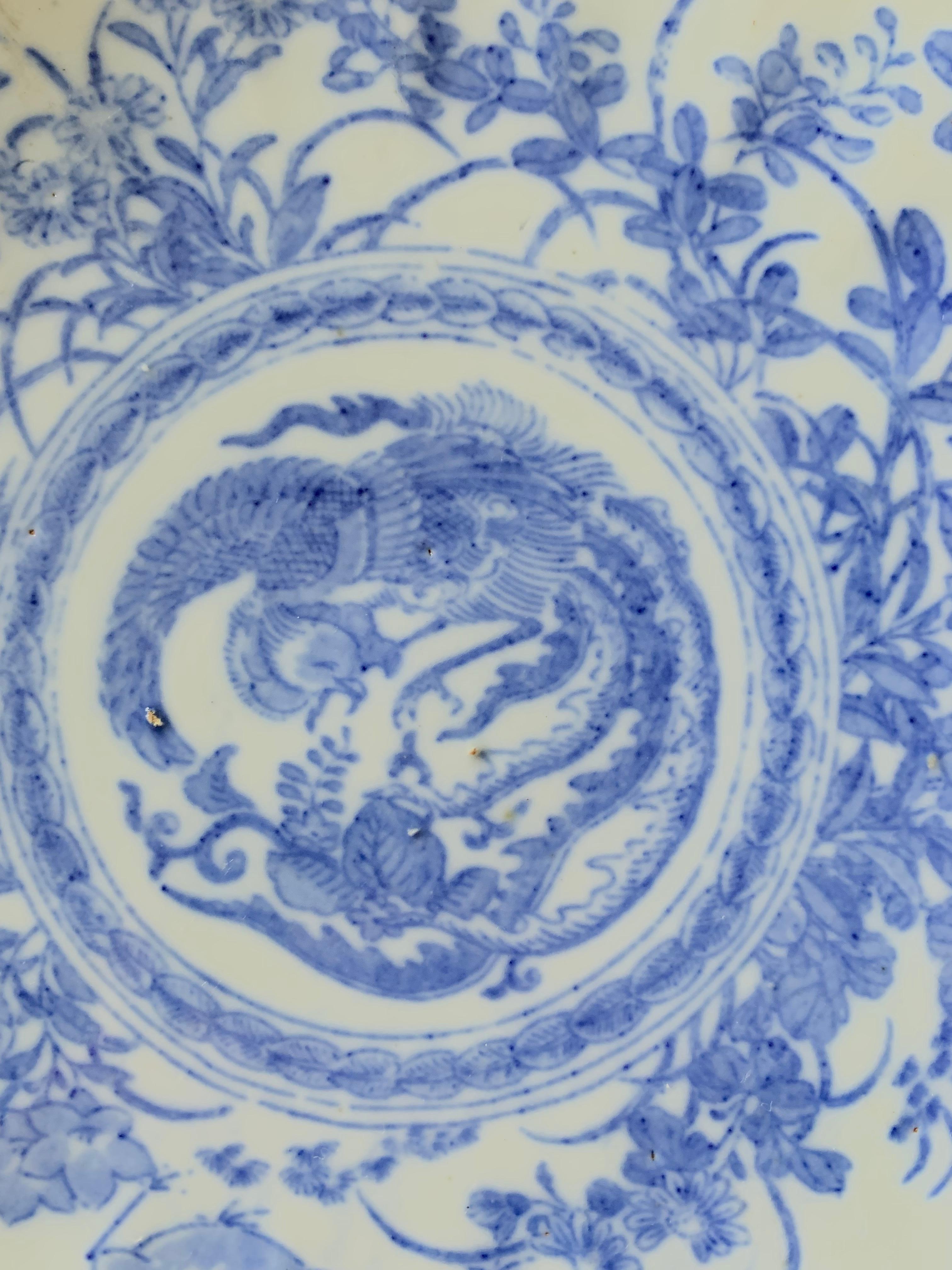 Nice plate inspired the Compagnie des Indes from the Qianlong period, XVIIIth century, But dating from the middle of 19th Century. 
It presents a decoration of birds, Flowers and foliages. It’s probably print. This porcelain is characteristic of