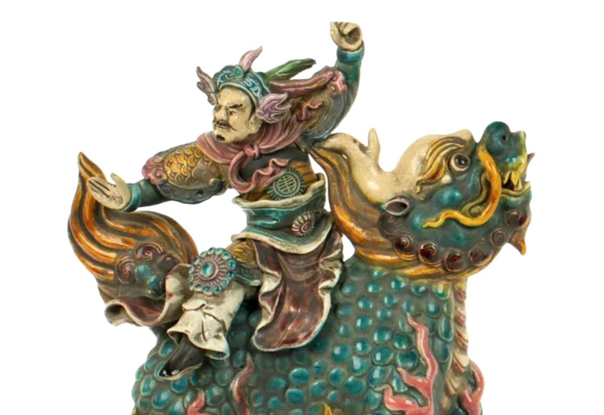 Chinese Polychrome Decorated Roof Tile affixed to acrylic stands. Whimsical Chinese tile depicting warrior on a Qilin creature, These tiles were historically used in roofing on traditional Chinese buildings, particularly temples or palaces. They are