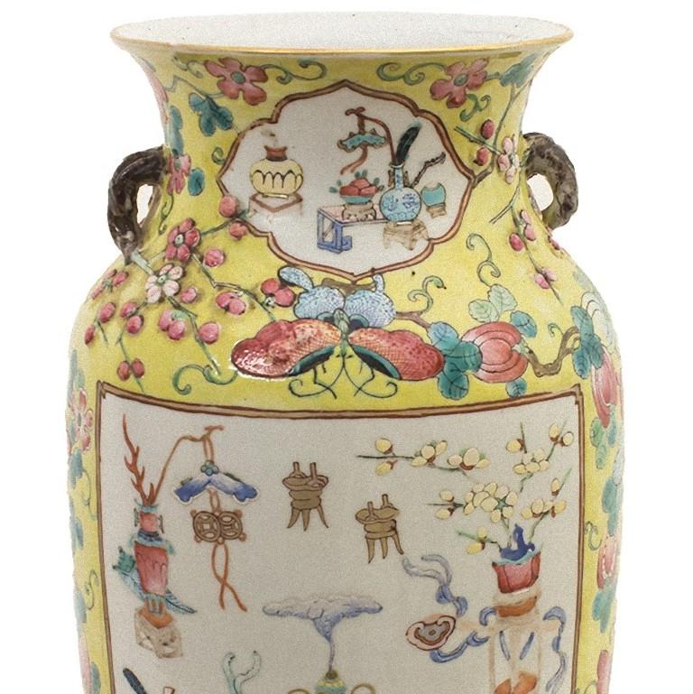 The Chinese polychrome vase is a superb ceramic vase, realized in the early 20th century. 

Yellow ground with polychrome fruits, butterflies and flowers, two large reserves with good omen objects.
In very good condition. 
Provenance: private