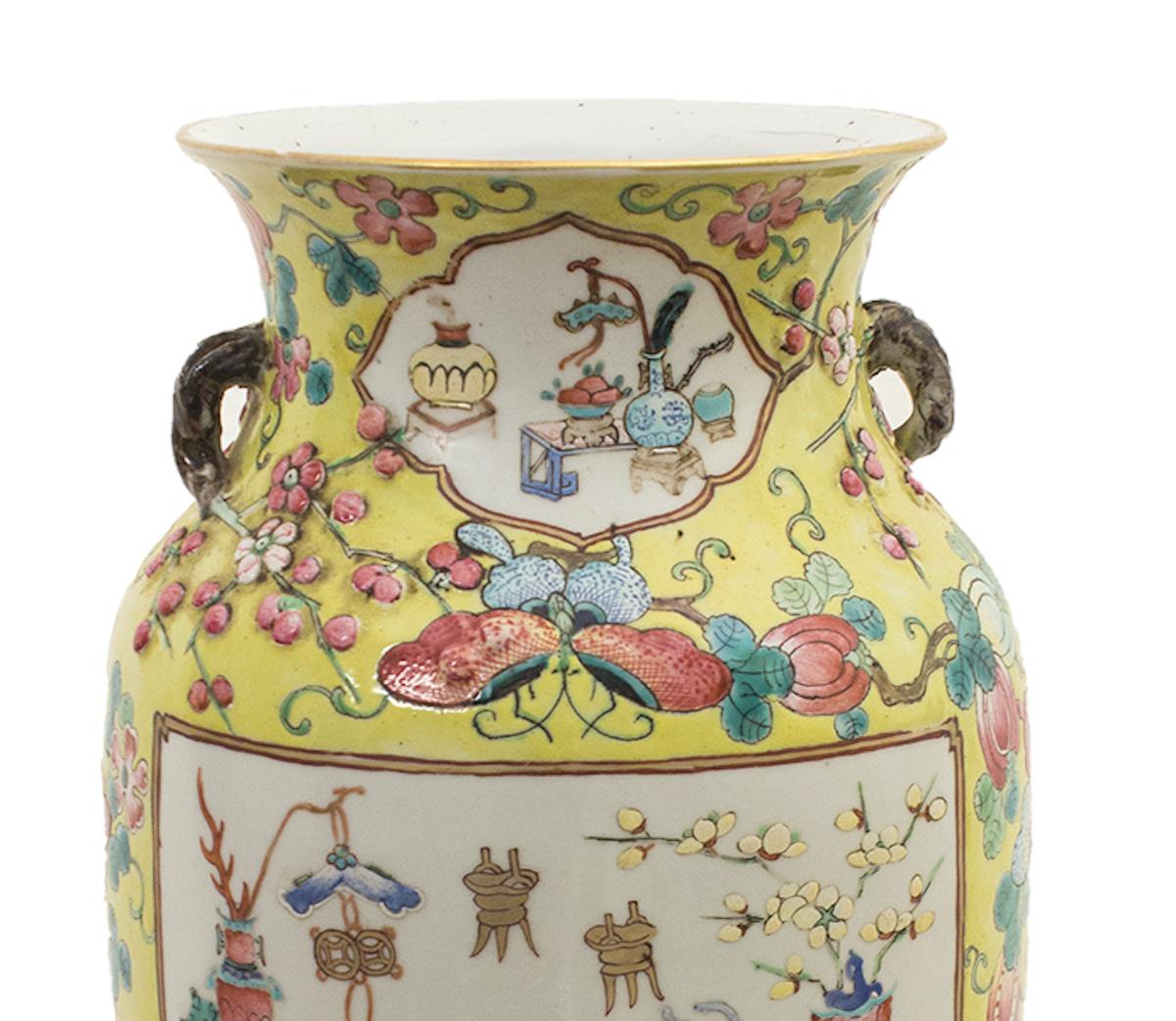 The Chinese polychrome vase is a superb ceramic vase, realized in the early 20th century. 

Yellow ground with polychrome fruits, butterflies and flowers, two large reserves with good omen objects.

In very good condition. 

Provenance: