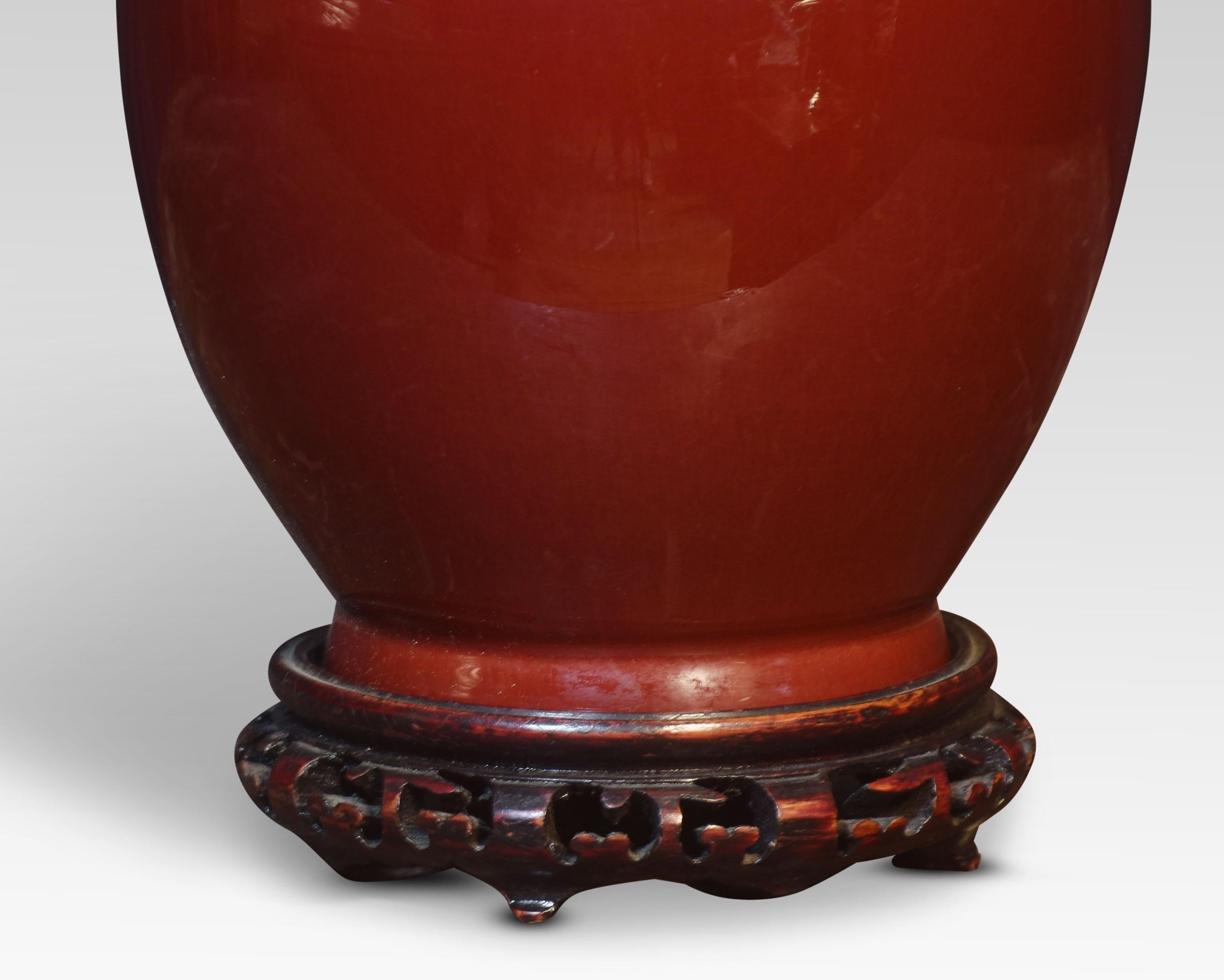 Chinese porcelain monochrome sang-de-boeuf baluster vase lamp, with carved and pierced wood base.
Dimensions
Height 22.5 Inches
Width 7 Inches
Depth 7 Inches