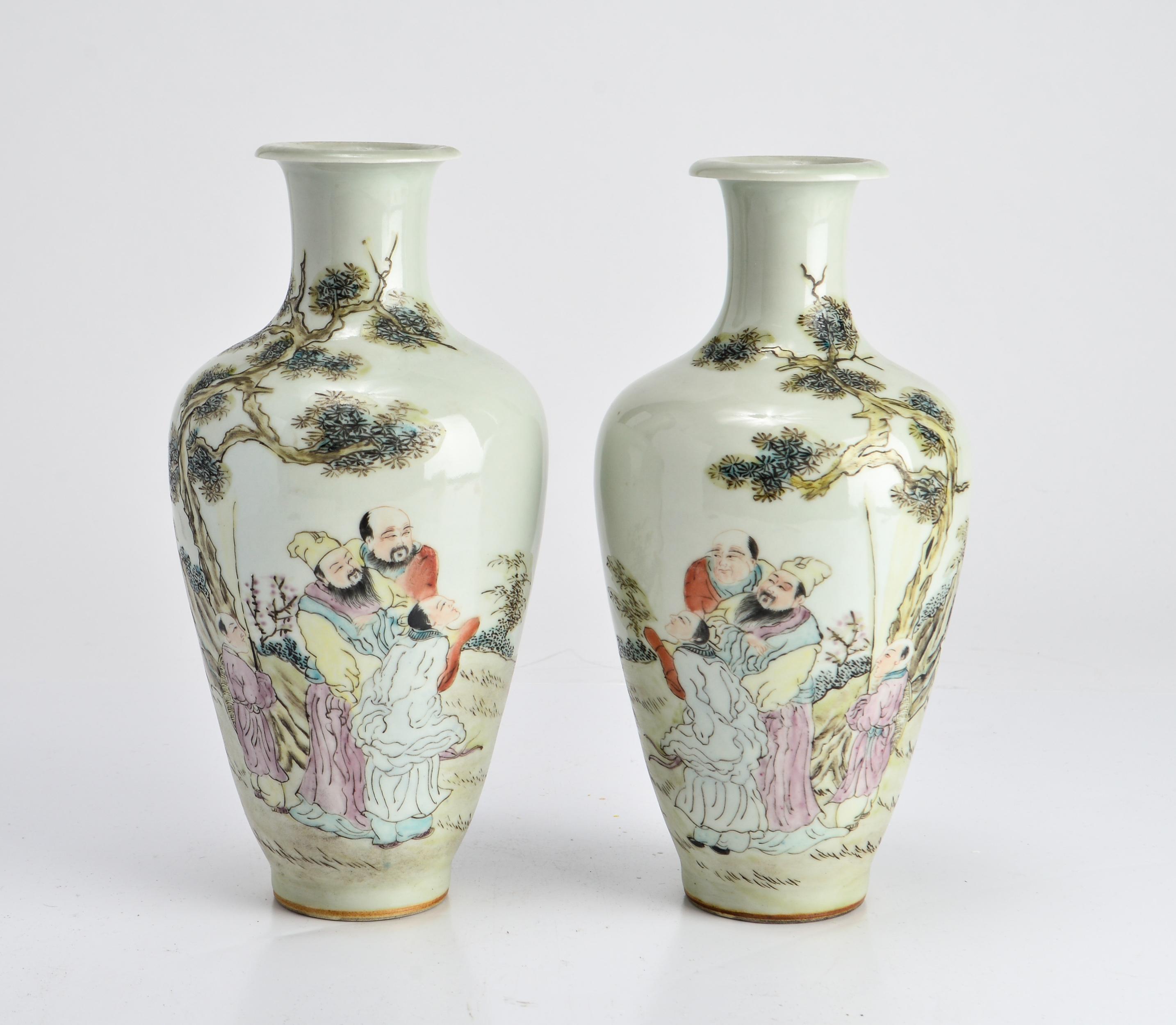 Pair of Chinese porcelain baluster vases, the body of each depicting scenes with robed scholars conversing amidst rockwork under pine trees. Reverse side with writing. In great vintage condition with age-appropriate wear and use.