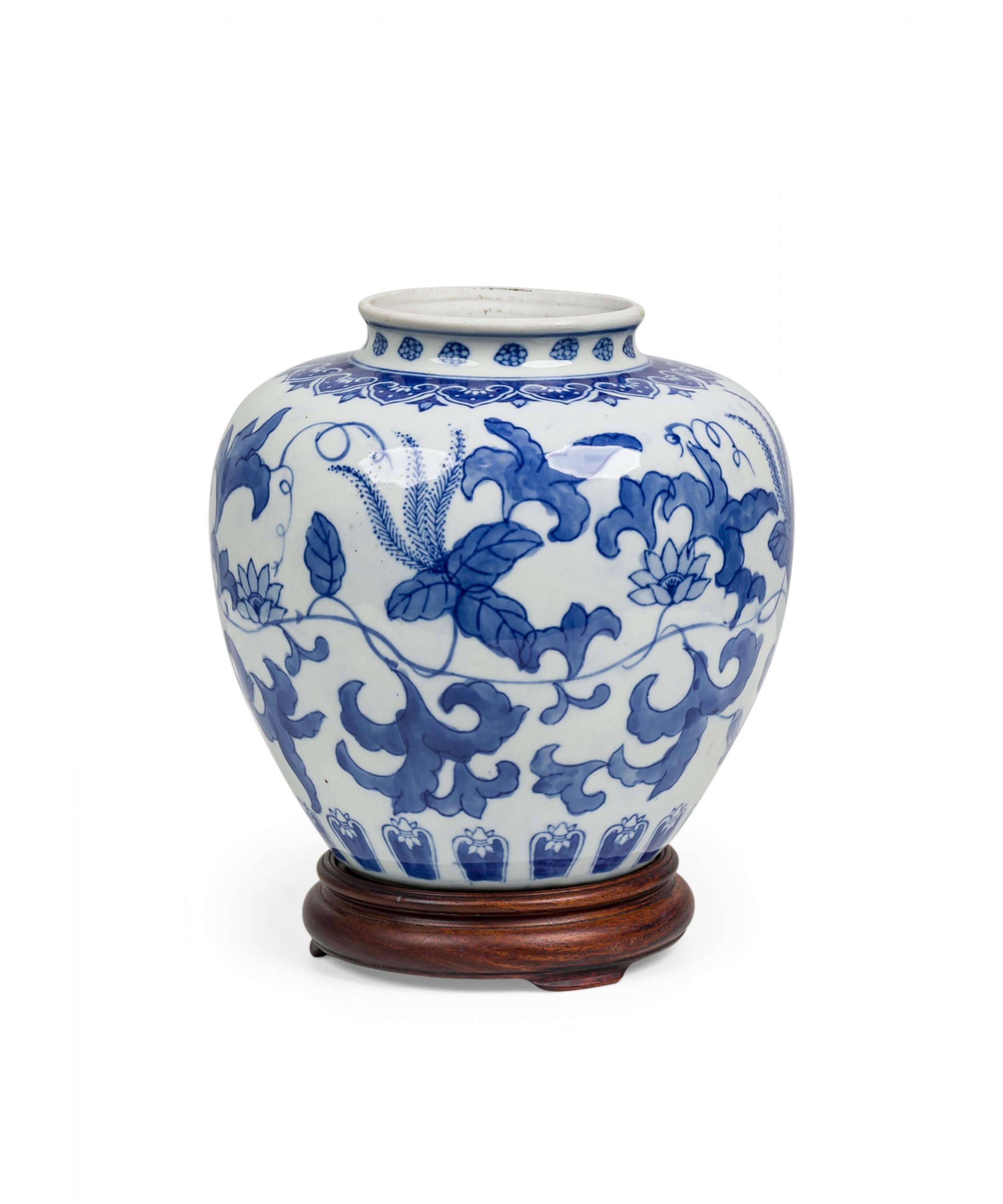 Painted Chinese Porcelain Blue & White Floral Ginger Jar on Carved Wood Stand For Sale