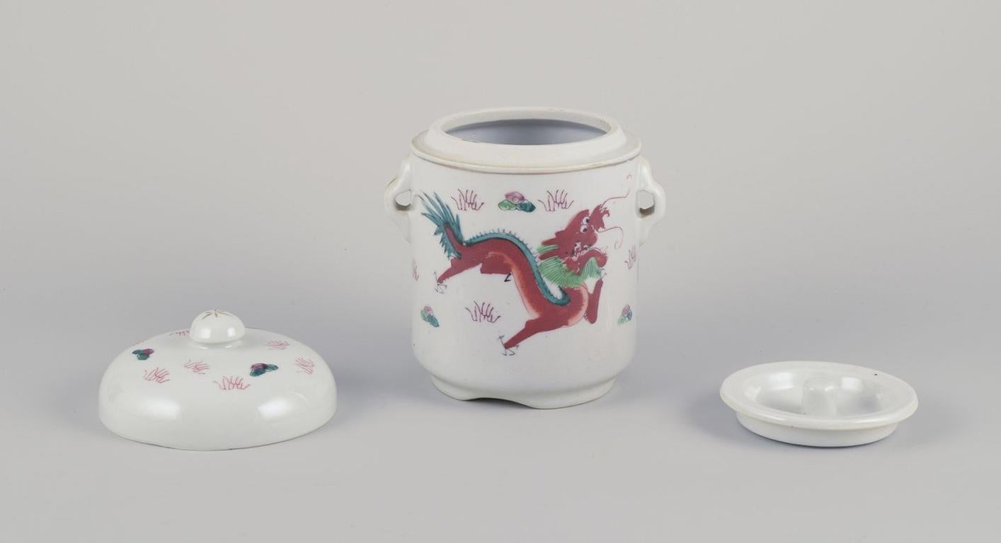 Pre-owned goods are exempt from import duties for U.S. customers. 
Therefore, no import tariffs will be applicable to your purchase.

Chinese porcelain container with two lids.
Hand-painted motif of dragons.
20th century.
Marked.
Condition: Perfect