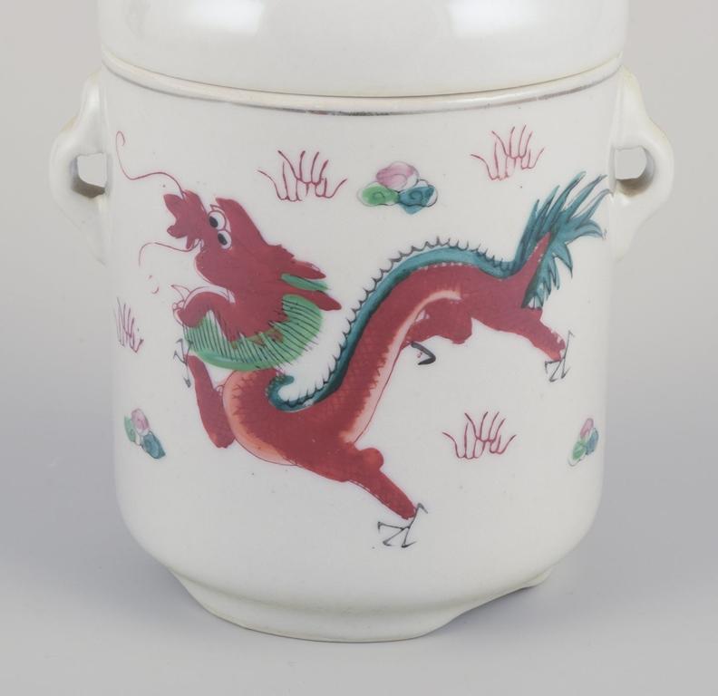 20th Century Chinese porcelain container with two lids. Hand-painted motif of dragons. 20th C For Sale