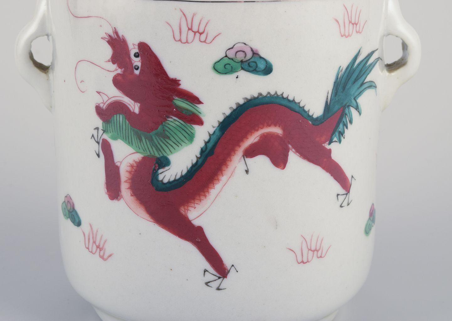Porcelain Chinese porcelain container with two lids. Hand-painted motif of dragons. 20th C For Sale