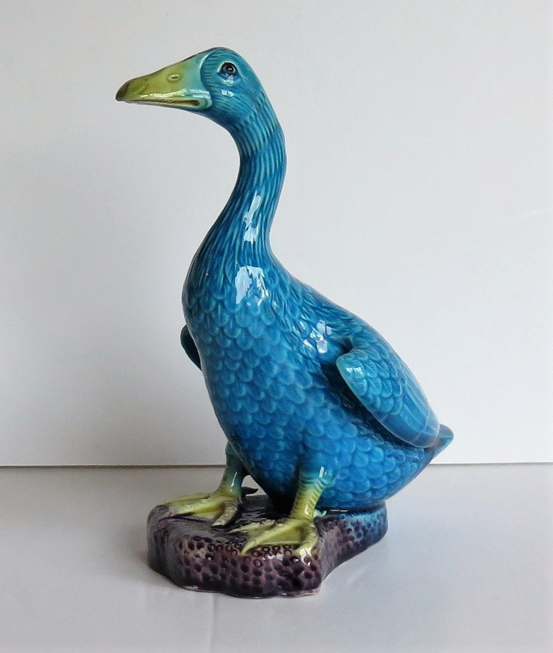 This is a good Chinese Export porcelain Goose Bird decorated in polychrome enamels and dating to the 1930s.

The bird figurine is well modelled and very life like, with the goose standing upright on a rocky base. The porcelain is decorated in bold