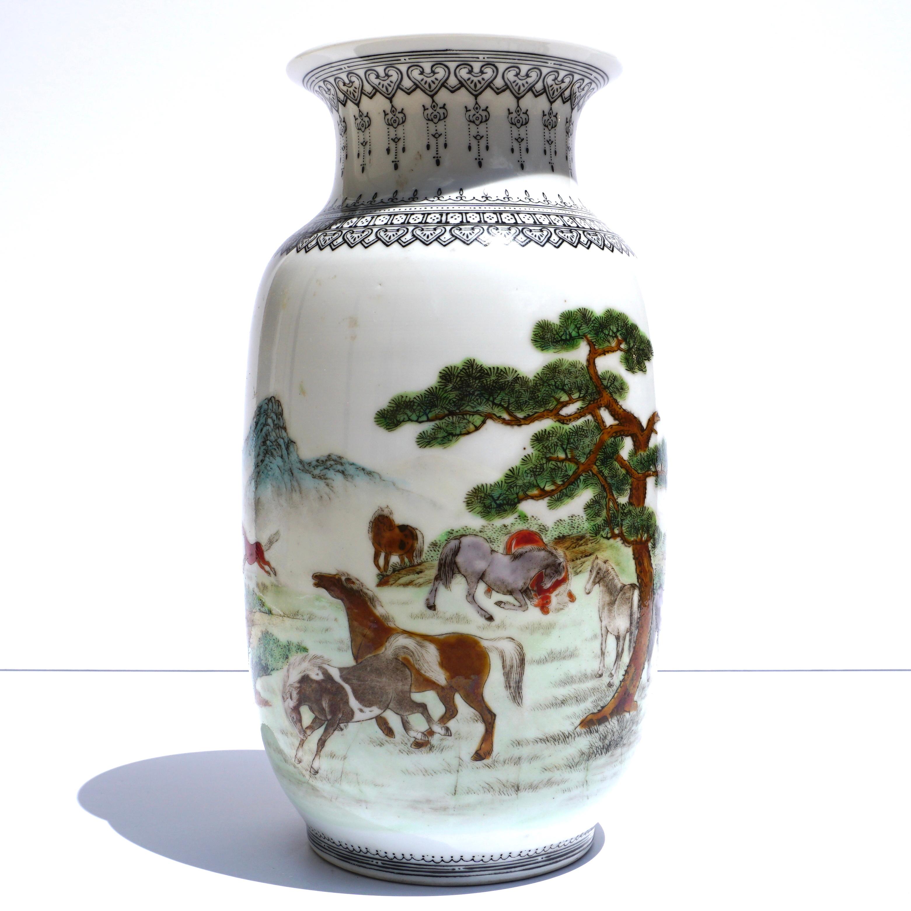 An early Chinese 20th century porcelain Enameled vase, having a trumpet neck and cylindrical body, decorated throughout with Tang and Han style horses on a coastal and tree landscape in a mountainous background. With characters said to be a romantic