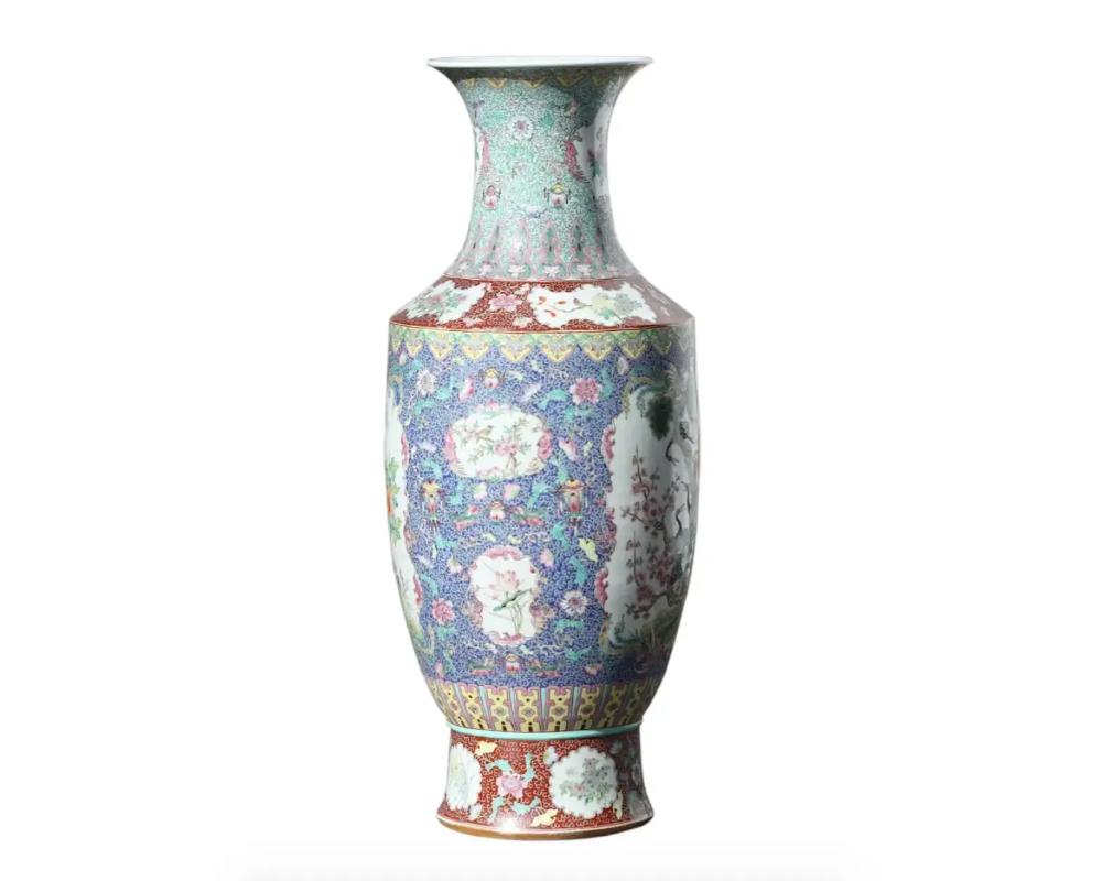 Chinese porcelain Famille Rose coral ground vase, baluster form with long neck and flared lip, painted with a stylized central bird perched on a branch and a landscape. Asymmetrical scene with painted foliage and flowers

Condition 
Overall good