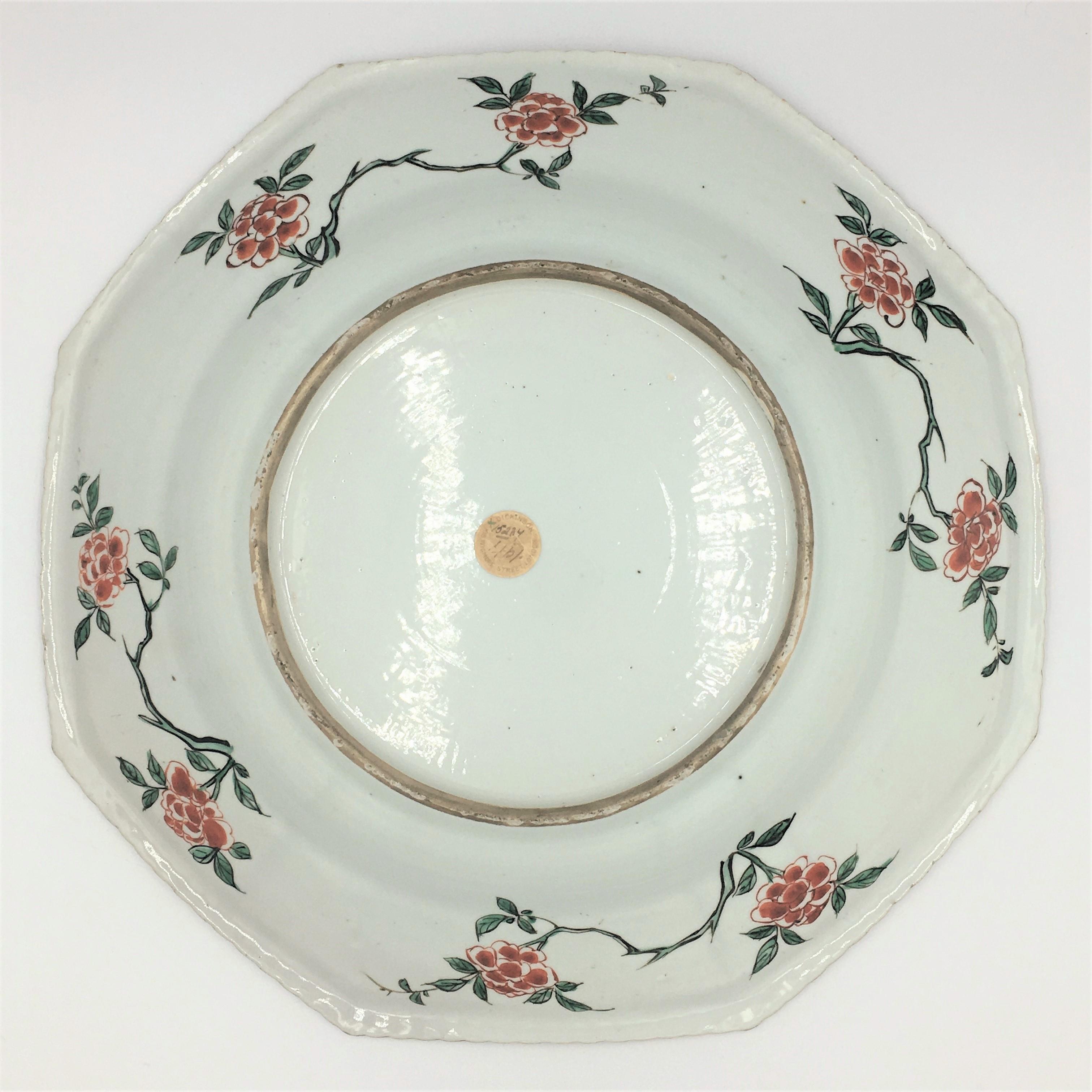 Kangxi period
A large Chinese Kangxi period Famille Verte octagonal dish having fine enamel decoration throughout. Two courting birds in a garden, which is framed by phoenix’s and peony’s in the octagonal piecrust enamel border. This is the middle