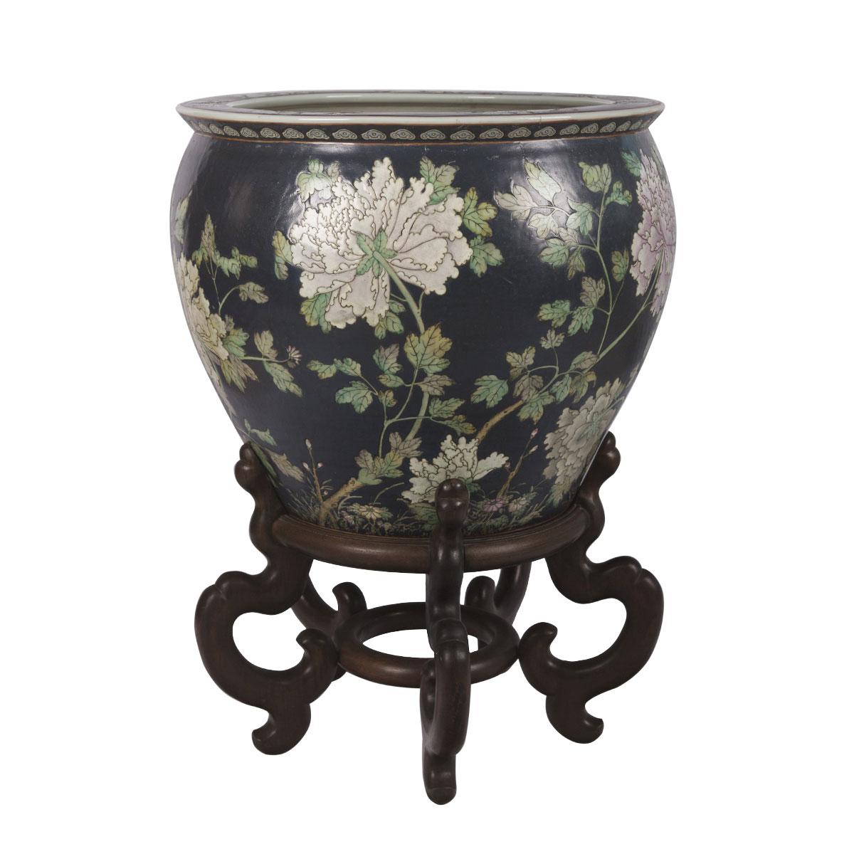 This porcelain Chinese flower pattern fish bowl was created in Hong Kong, China around 1960. Fish bowl is round in shape, the porcelain bowl features beautiful hand painted floral design throughout the exterior. The interior is painted on the inside