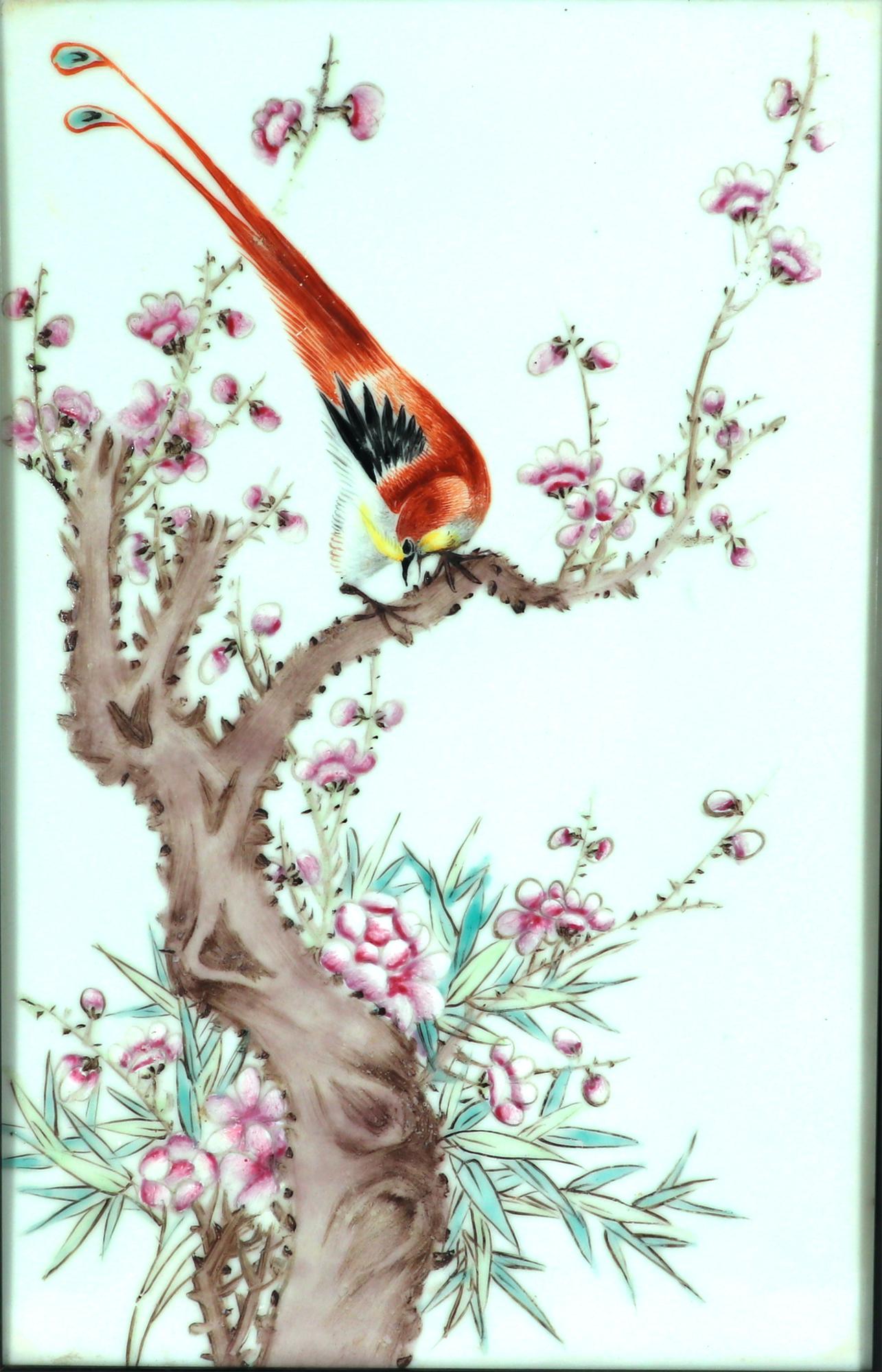 Chinese Porcelain Framed Famille Rose Plaque of Golden Pheasant on a Flowering Tree Branch,
20th Century,

The large porcelain plaque, in an upright format, depicts a large Golden Pheasant on a  flowering tree branch.  

All within a gilt and black