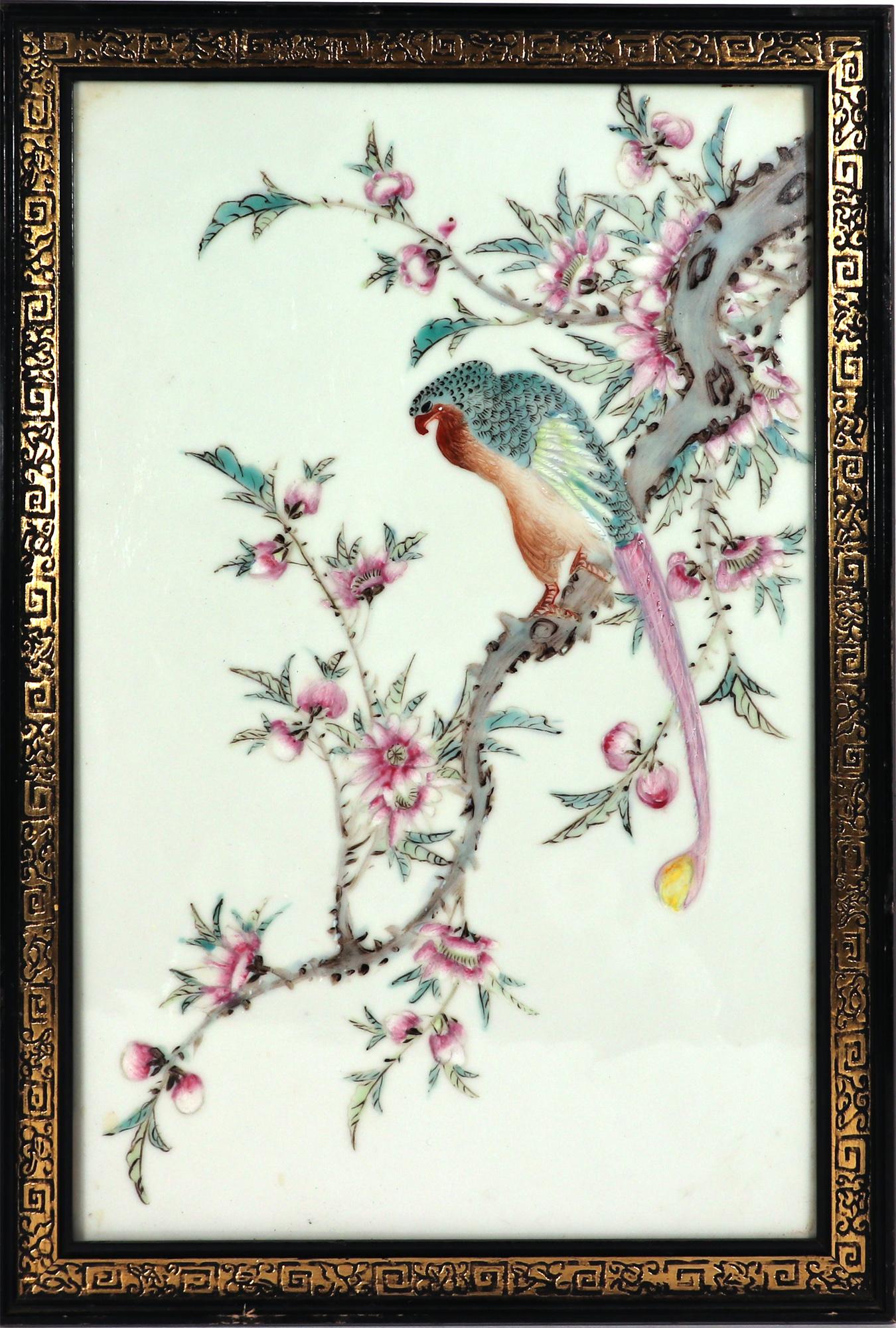 20th Century Chinese Porcelain Plaque

This 20th-century Chinese porcelain plaque features a long-tailed hawk perched on a flowering rose branch. The scene is rendered in the Famille Rose palette, known for its vibrant enamels. The plaque is